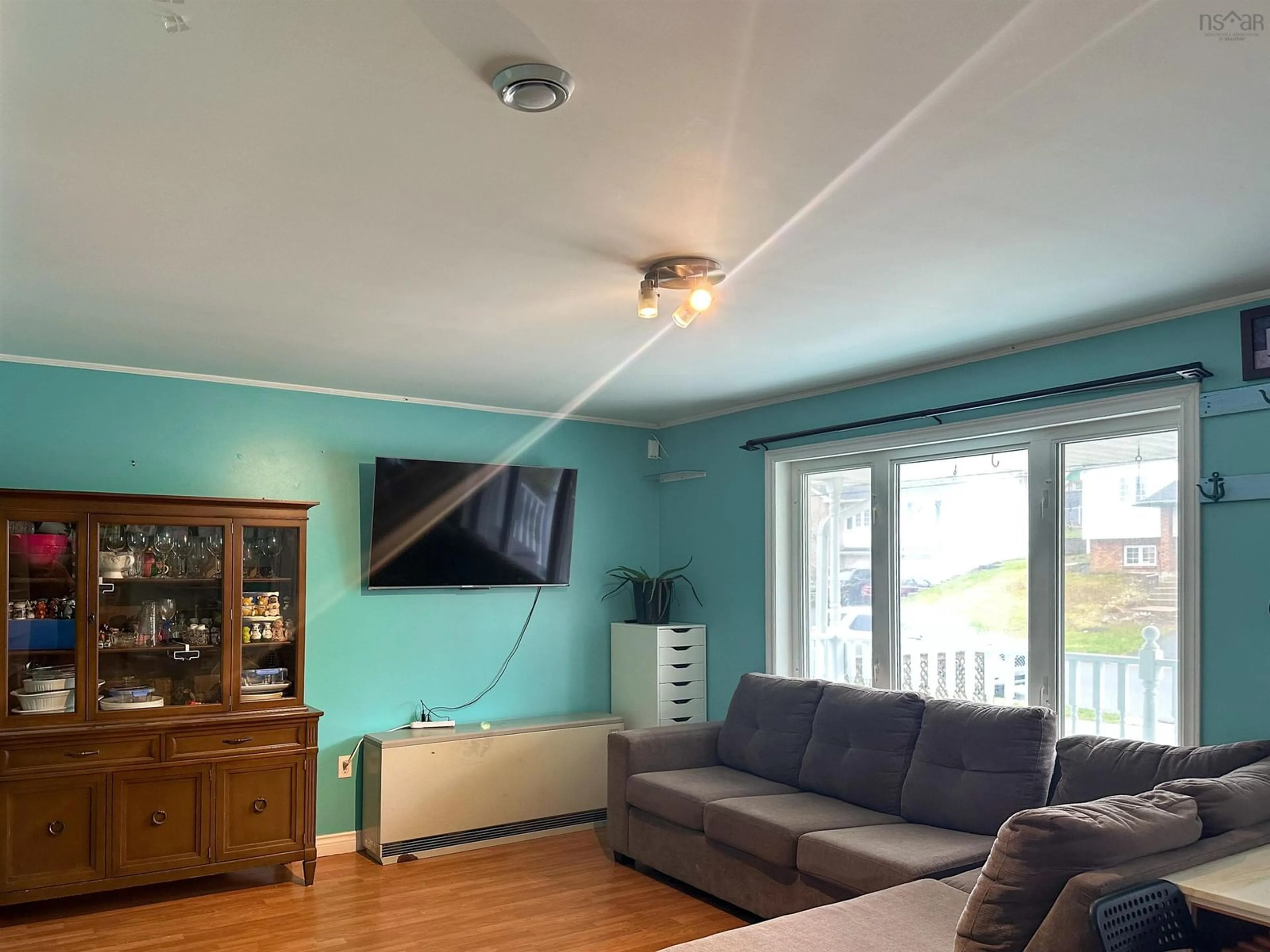 Living room with furniture, wood/laminate floor for 220 Auburn Dr, Westphal Nova Scotia B2W 6G2