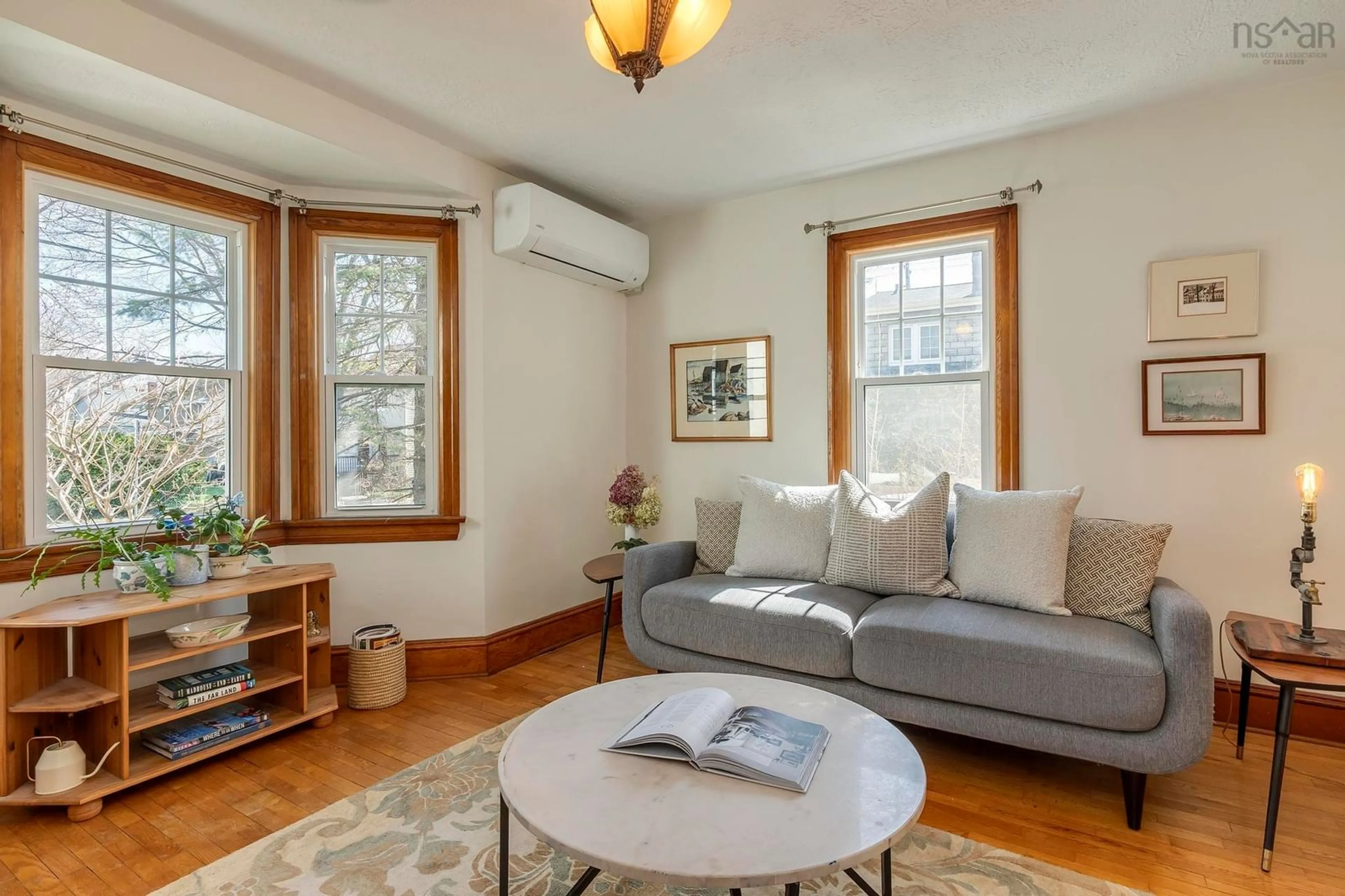 Living room with furniture, wood/laminate floor for 6379 Vienna St, Halifax Nova Scotia B3L 1S5