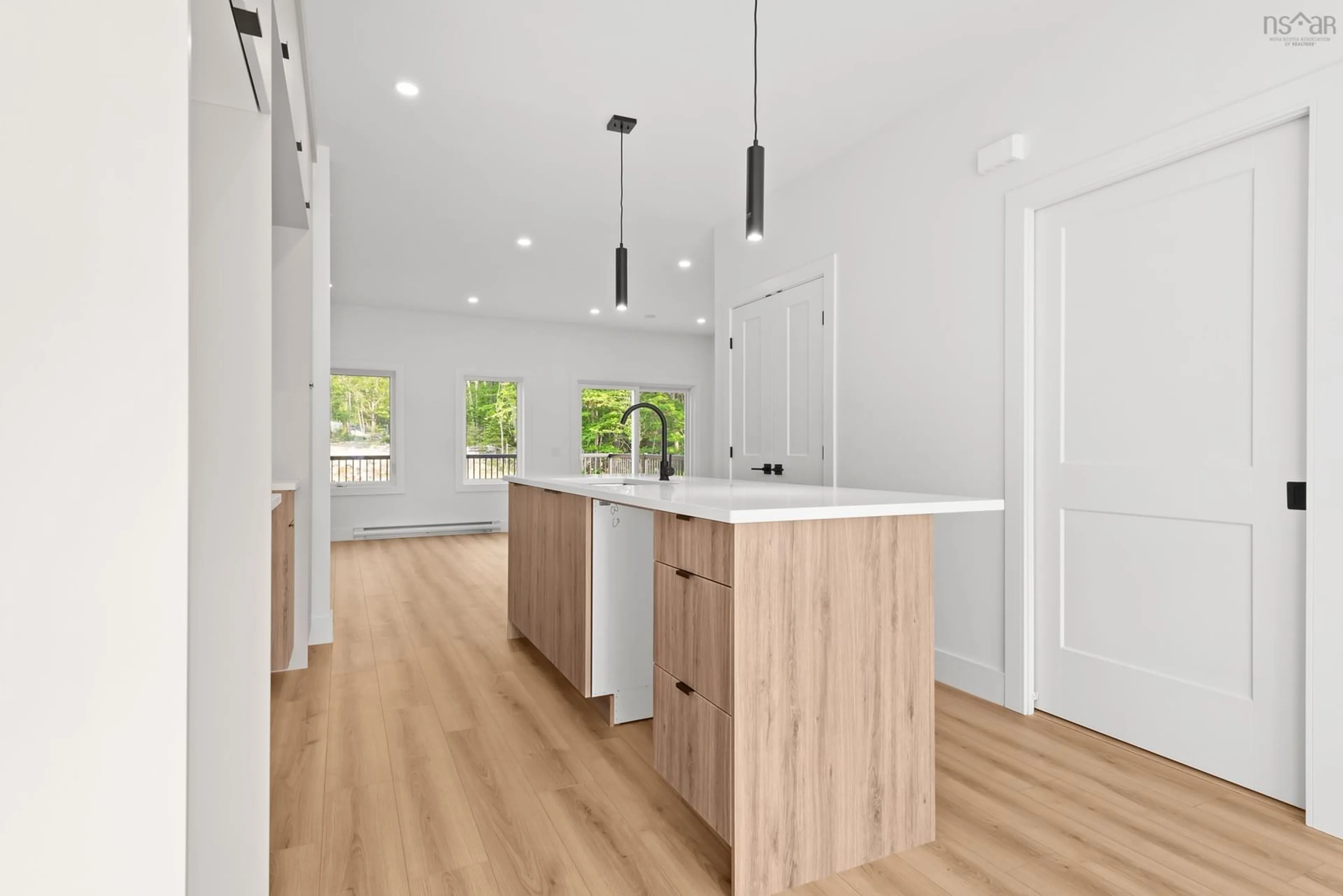 Open concept kitchen, wood/laminate floor for 154 Colonial Cres, Halifax Nova Scotia B3R 0H8