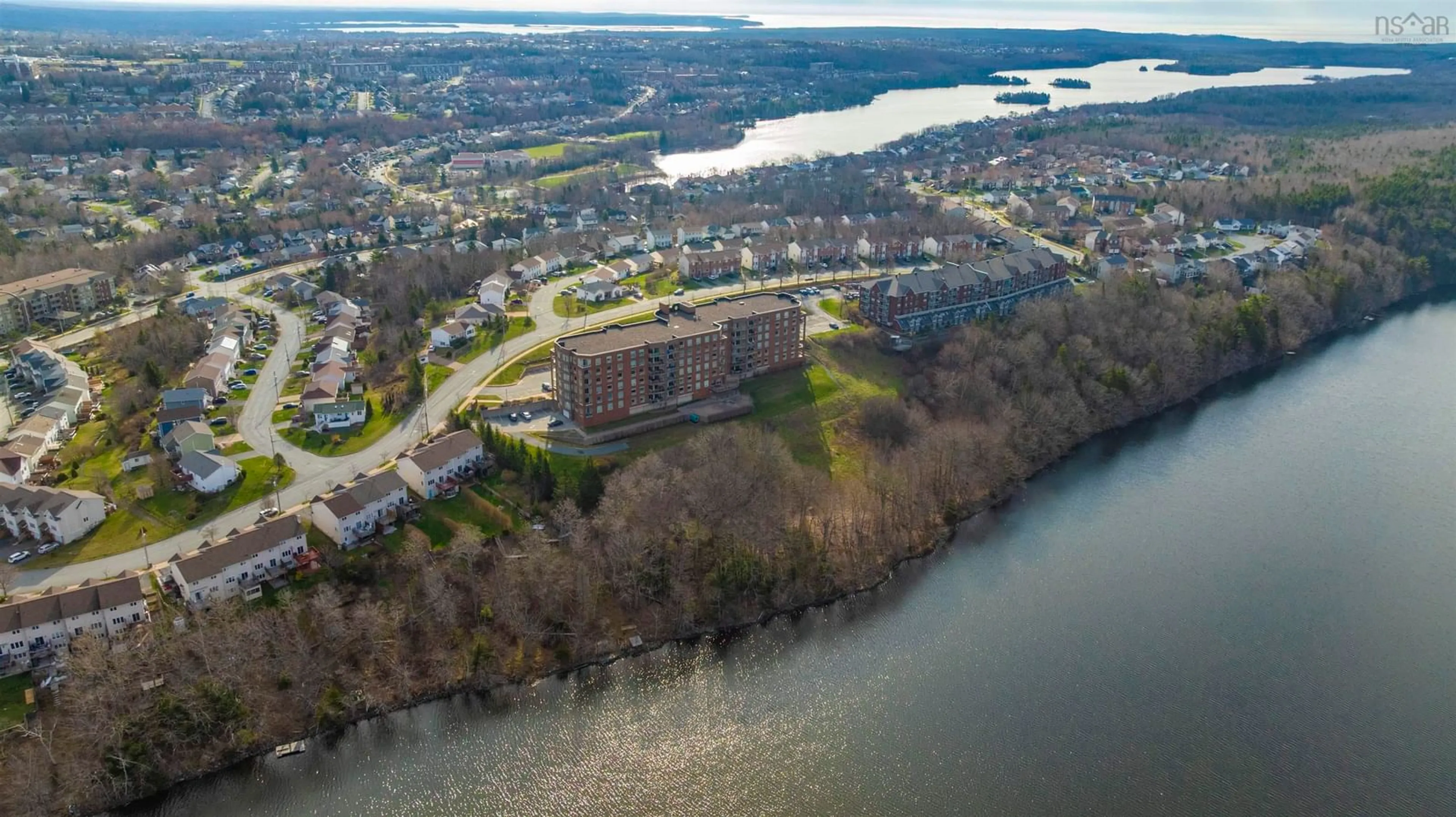 A pic from outside/outdoor area/front of a property/back of a property/a pic from drone, water/lake/river/ocean view for 77 Russell Lake Dr #105, Dartmouth Nova Scotia B2W 6R8