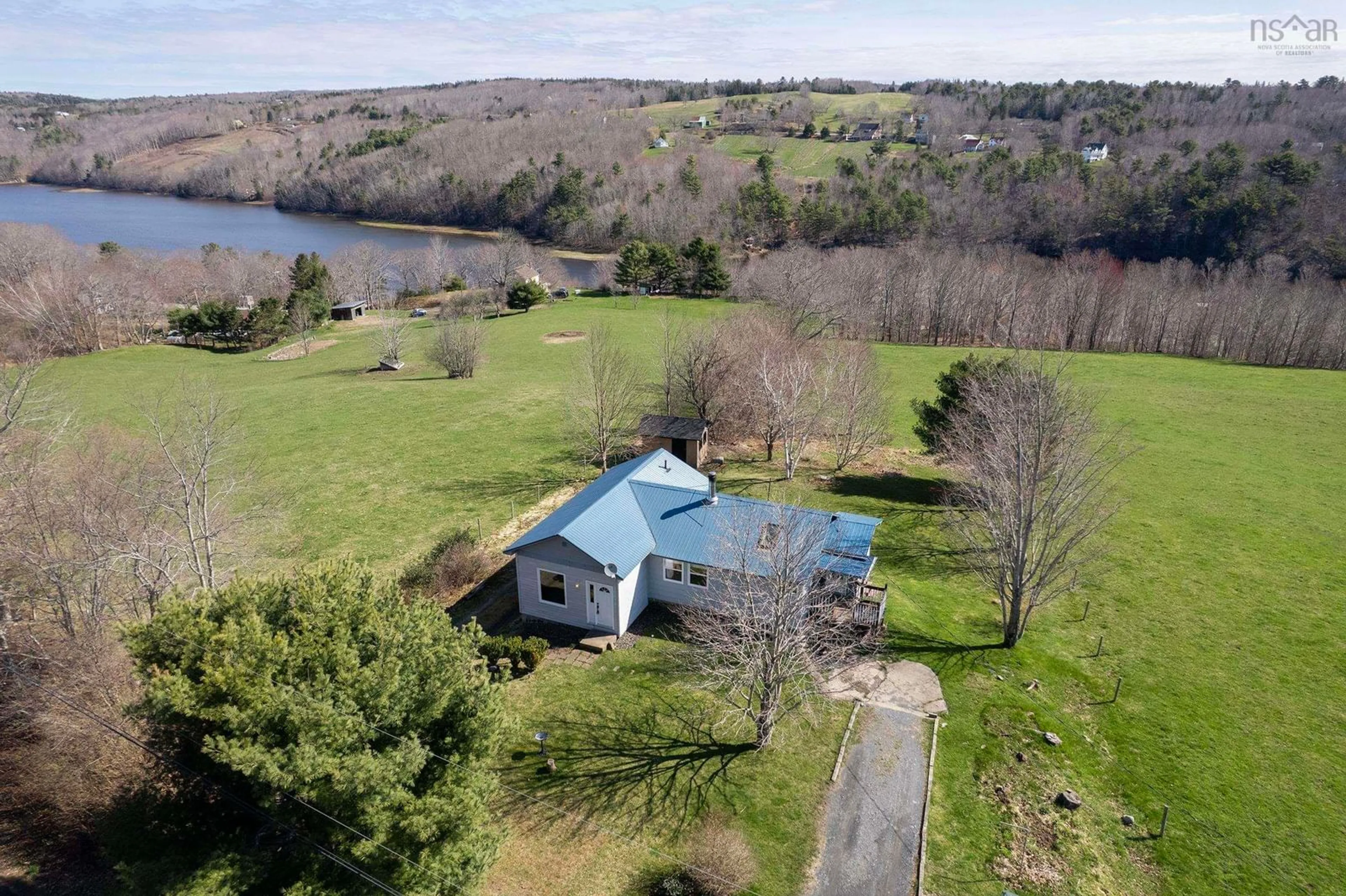 A pic from outside/outdoor area/front of a property/back of a property/a pic from drone, water/lake/river/ocean view for 819 Riverview Rd, Bear River Nova Scotia B0S 1B0