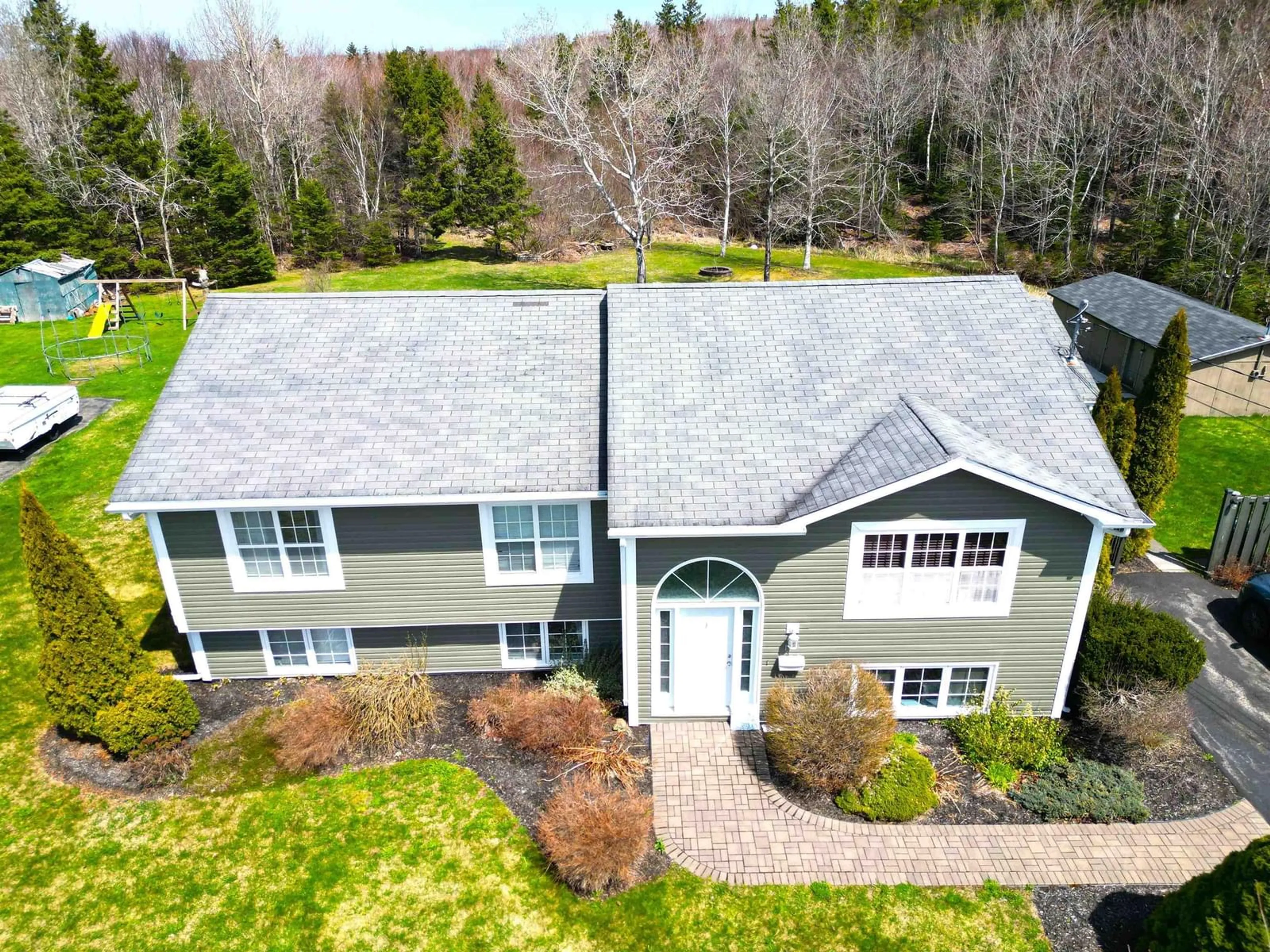 A pic from outside/outdoor area/front of a property/back of a property/a pic from drone, unknown for 179 Woodlawn Dr, Sydney River Nova Scotia B1S 1J1