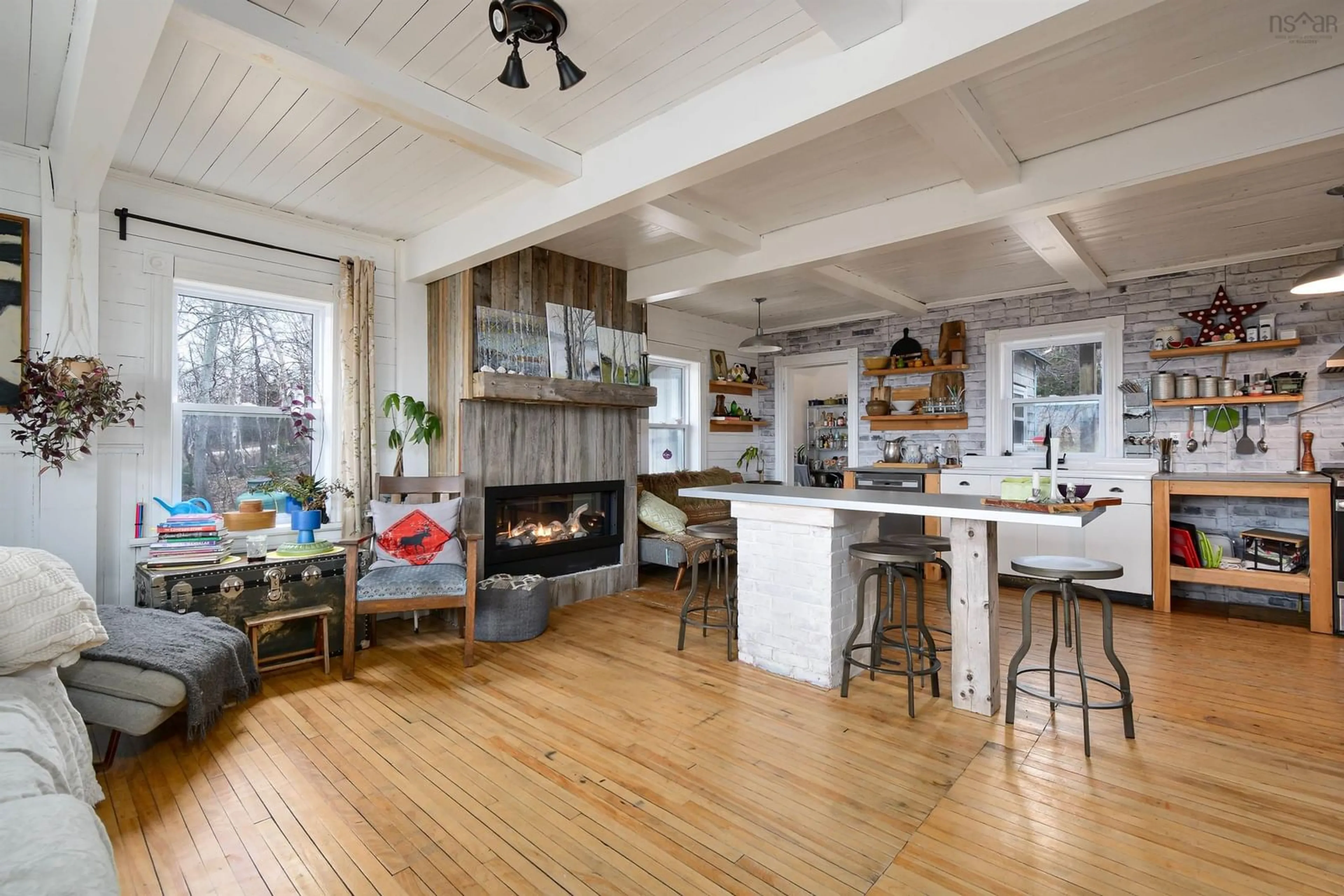 Open concept kitchen, wood/laminate floor for 29219 Cabot Trail, Cape North Nova Scotia B0C 1G0