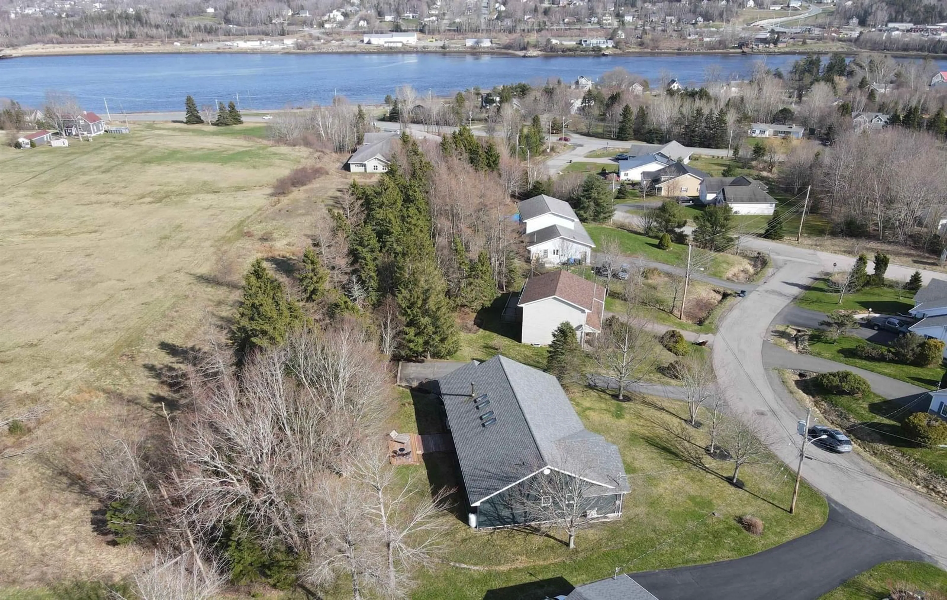 A pic from outside/outdoor area/front of a property/back of a property/a pic from drone, water/lake/river/ocean view for 9 Amberwood Cres, Westmount Nova Scotia B1R 2L1