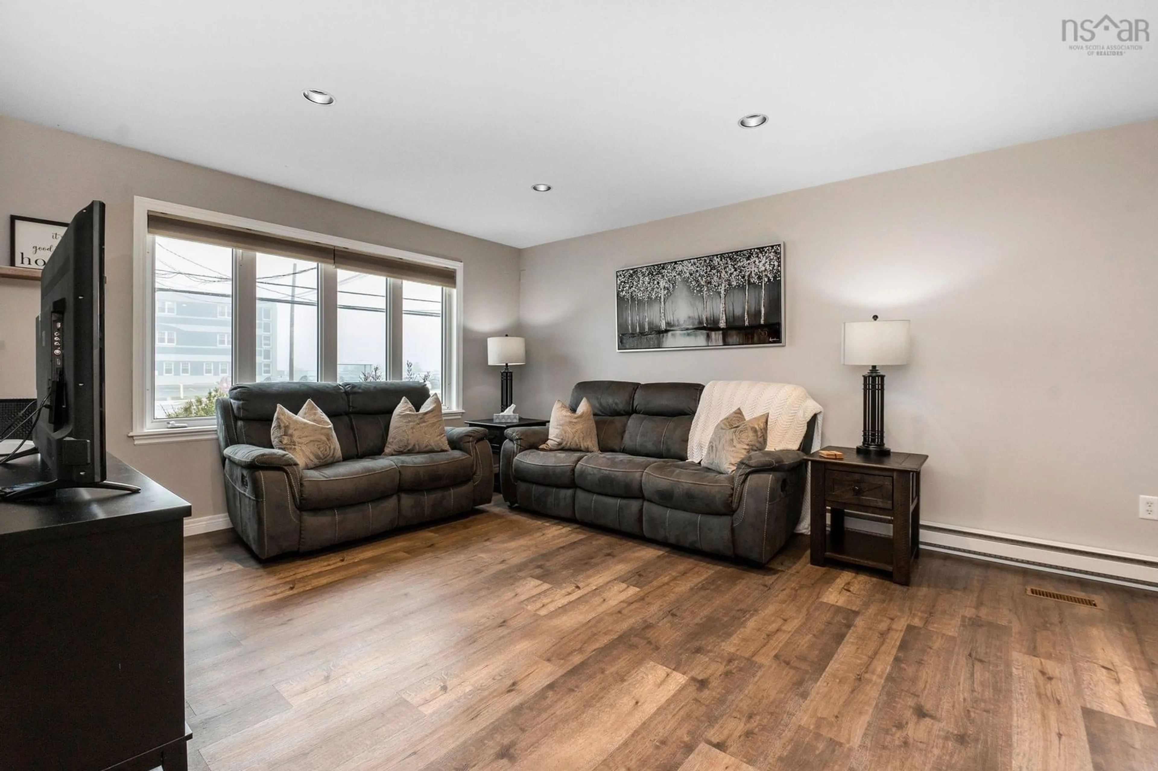 Living room with furniture, wood/laminate floor for 1918 Caldwell Rd, Eastern Passage Nova Scotia B3G 1J3