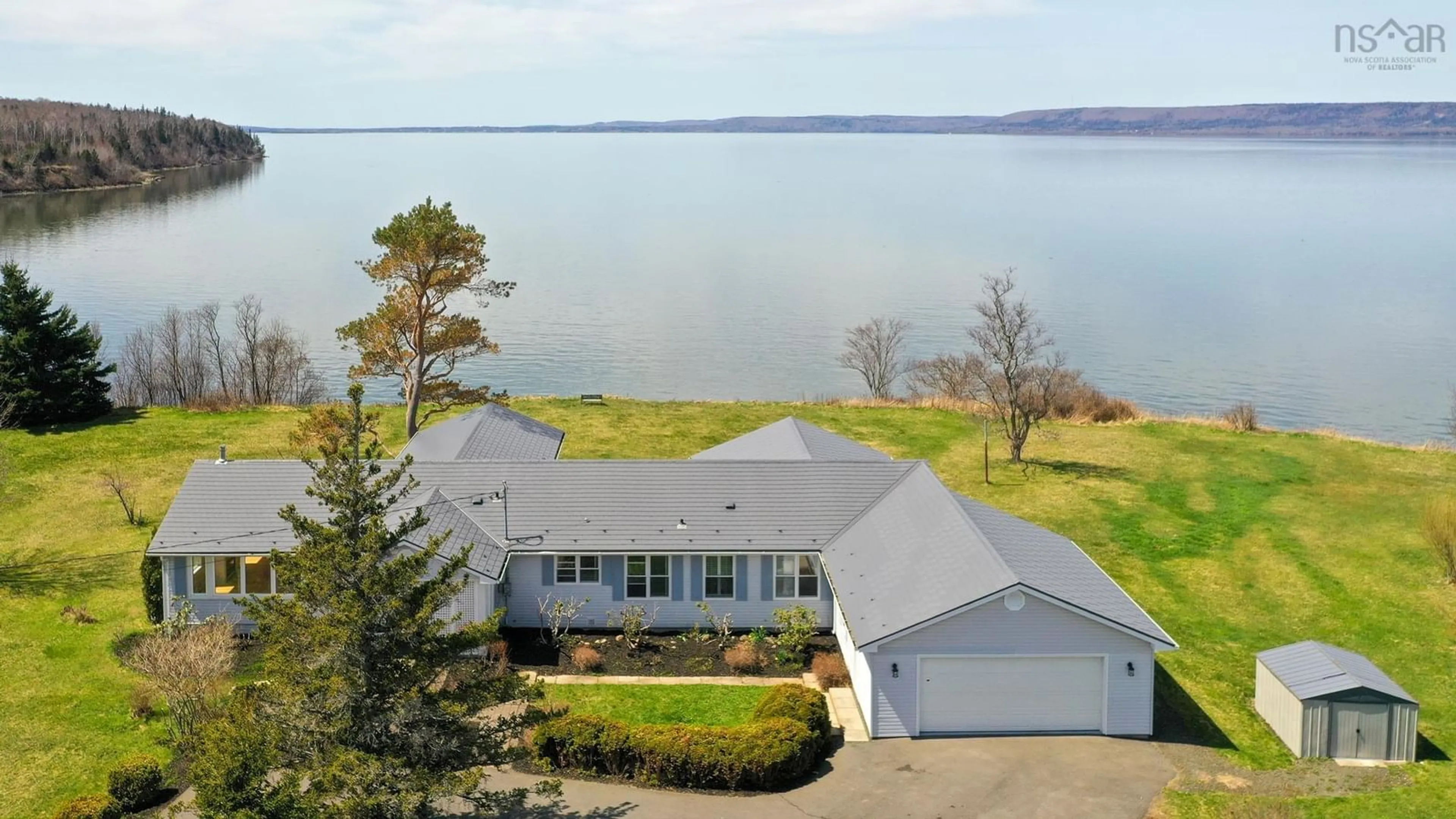 A pic from outside/outdoor area/front of a property/back of a property/a pic from drone, water/lake/river/ocean view for 27 Twin Cove Rd, Clementsport Nova Scotia B0S 1E0