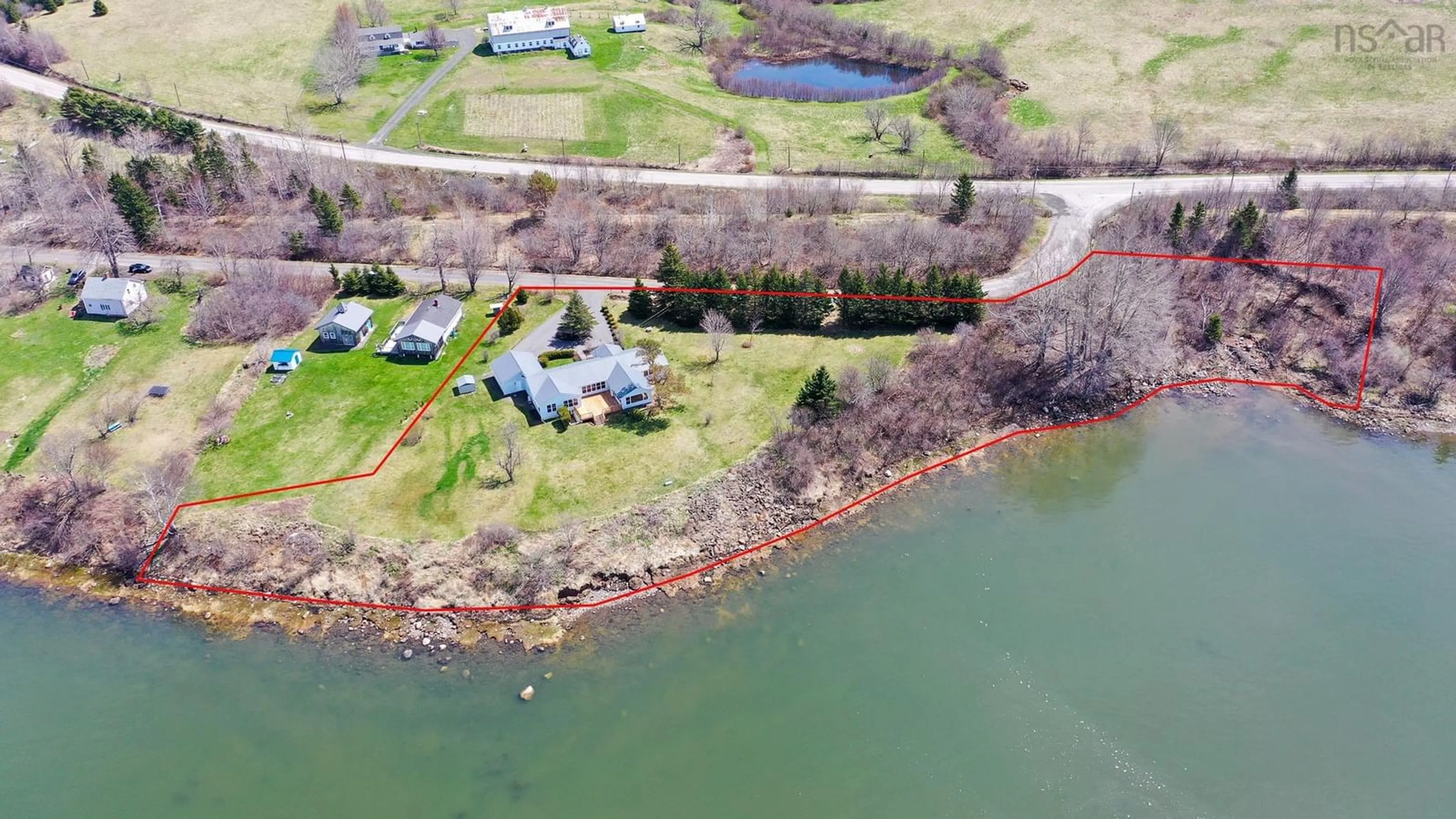 A pic from outside/outdoor area/front of a property/back of a property/a pic from drone, water/lake/river/ocean view for 27 Twin Cove Rd, Clementsport Nova Scotia B0S 1E0