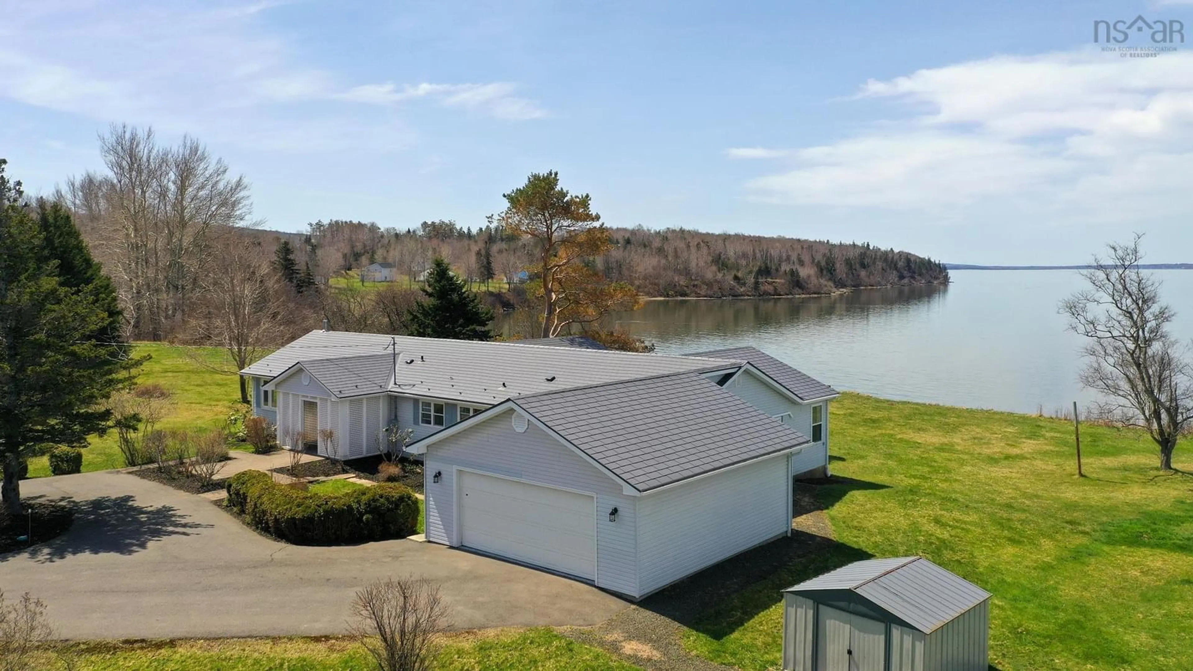 A pic from outside/outdoor area/front of a property/back of a property/a pic from drone, water/lake/river/ocean view for 27 Twin Cove Rd, Clementsport Nova Scotia B0S 1E0
