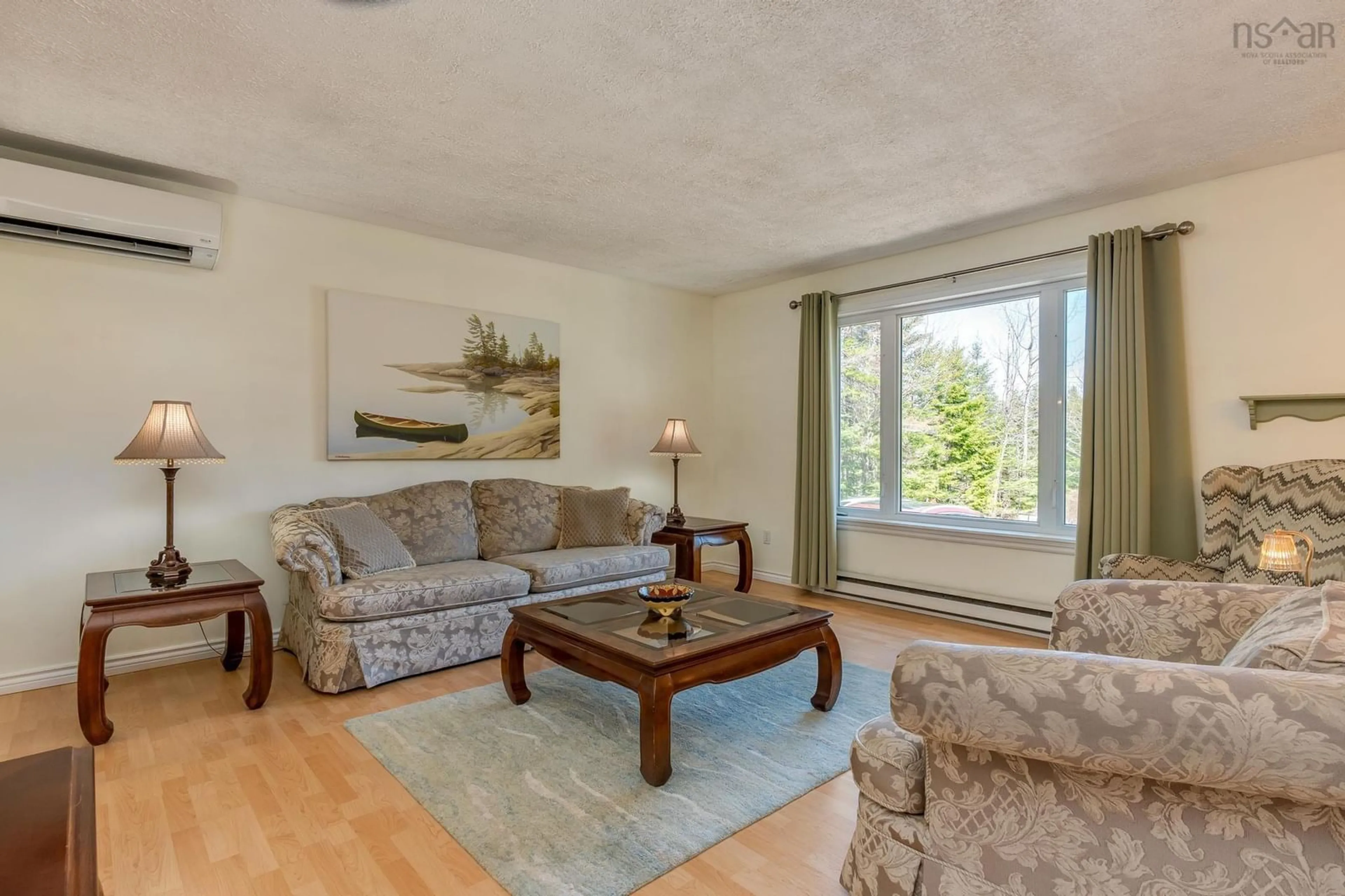 Living room with furniture, wood/laminate floor for 20 Kipawa Cres, Hammonds Plains Nova Scotia B4B 1N2
