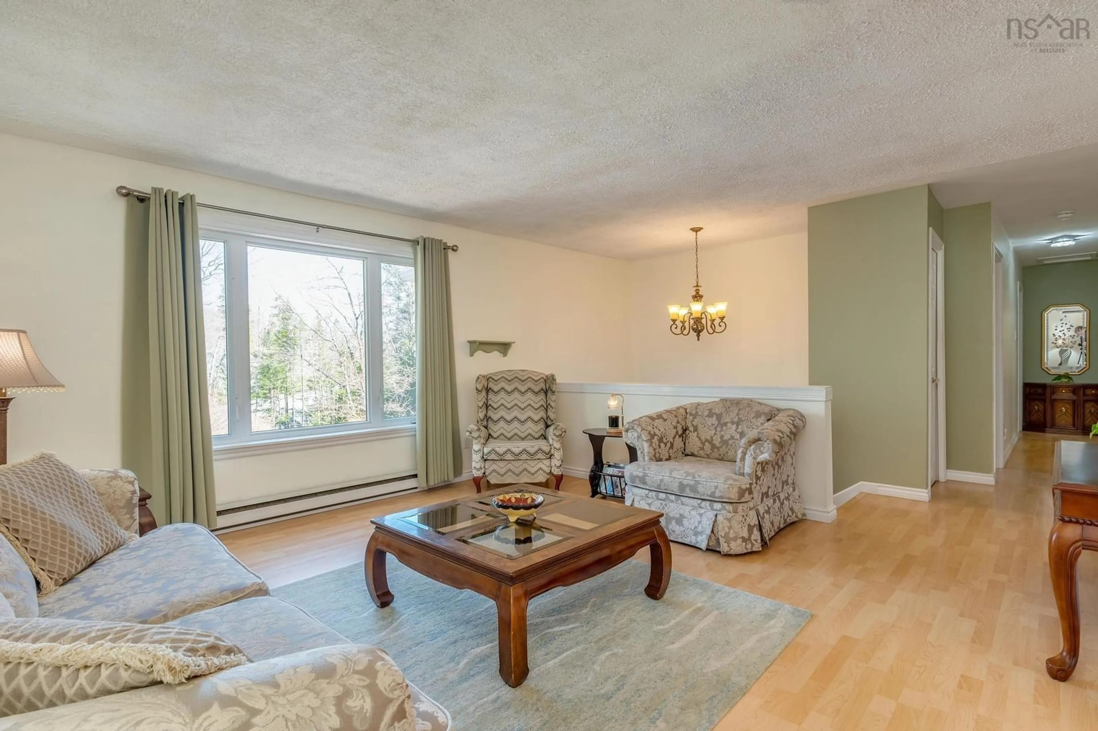Living room with furniture, wood/laminate floor for 20 Kipawa Cres, Hammonds Plains Nova Scotia B4B 1N2