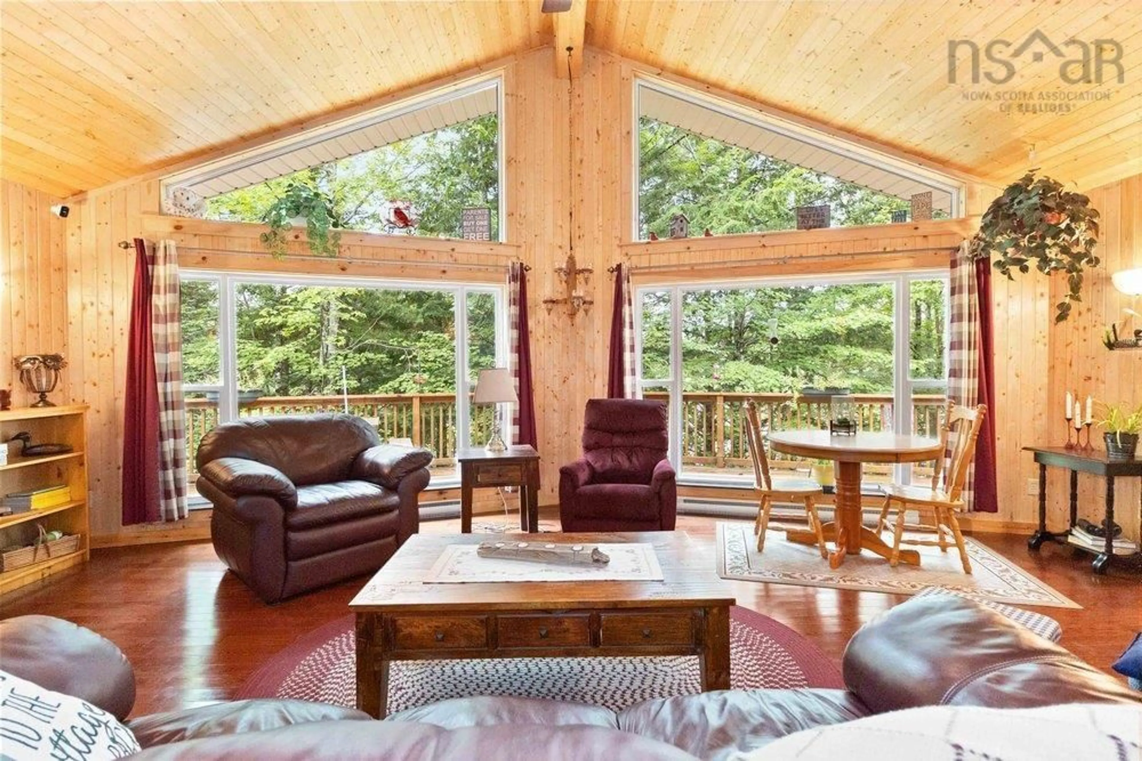 Living room with furniture, wood/laminate floor for 93 South Point Lane, Franey Corner Nova Scotia B0R 1A0