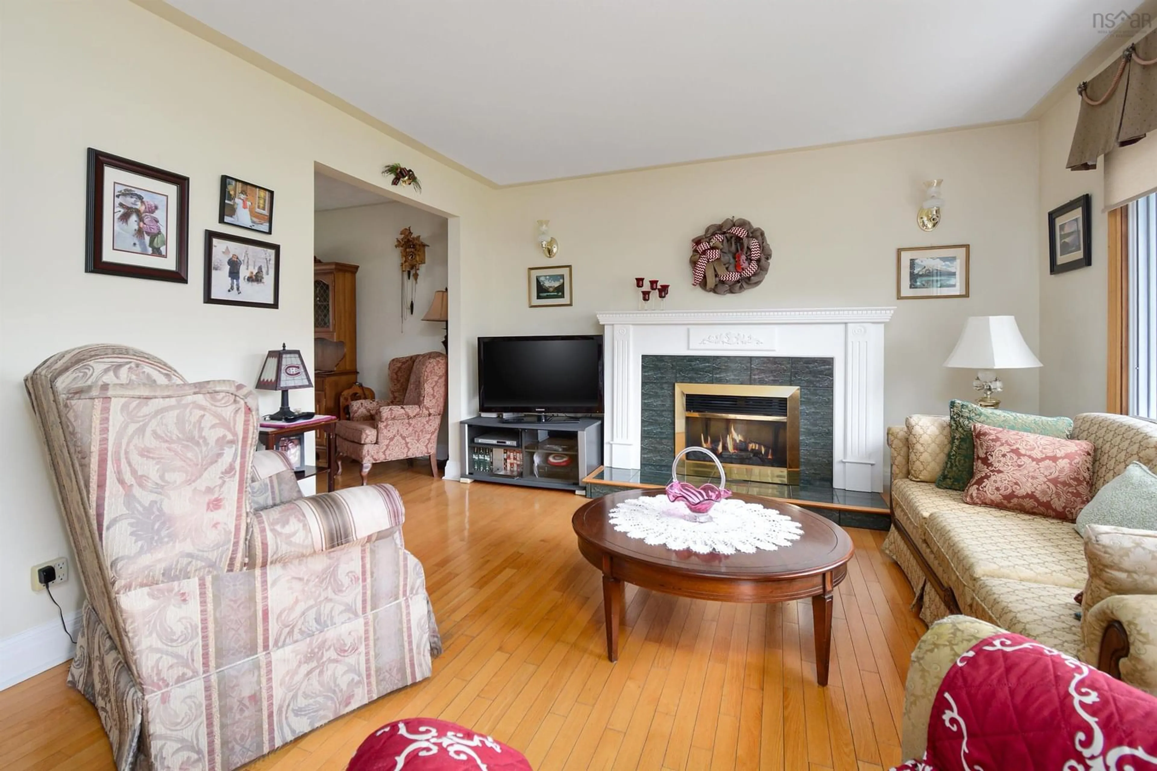 Living room with furniture, wood/laminate floor for 65 Parkwood Dr, Sydney Nova Scotia B1S 1H6