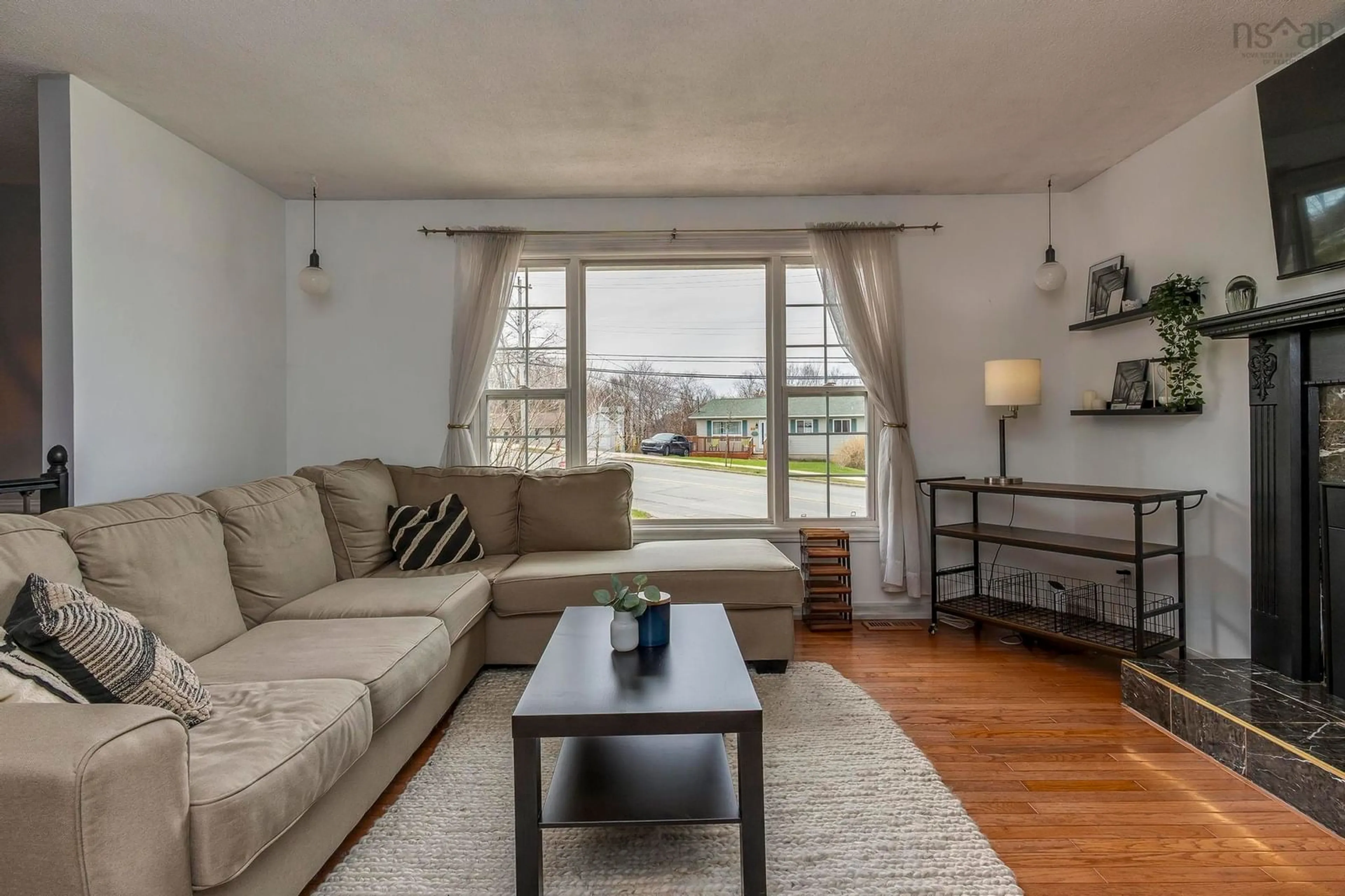 Living room with furniture, wood/laminate floor for 207 Caledonia Rd, Dartmouth Nova Scotia B2X 1L5