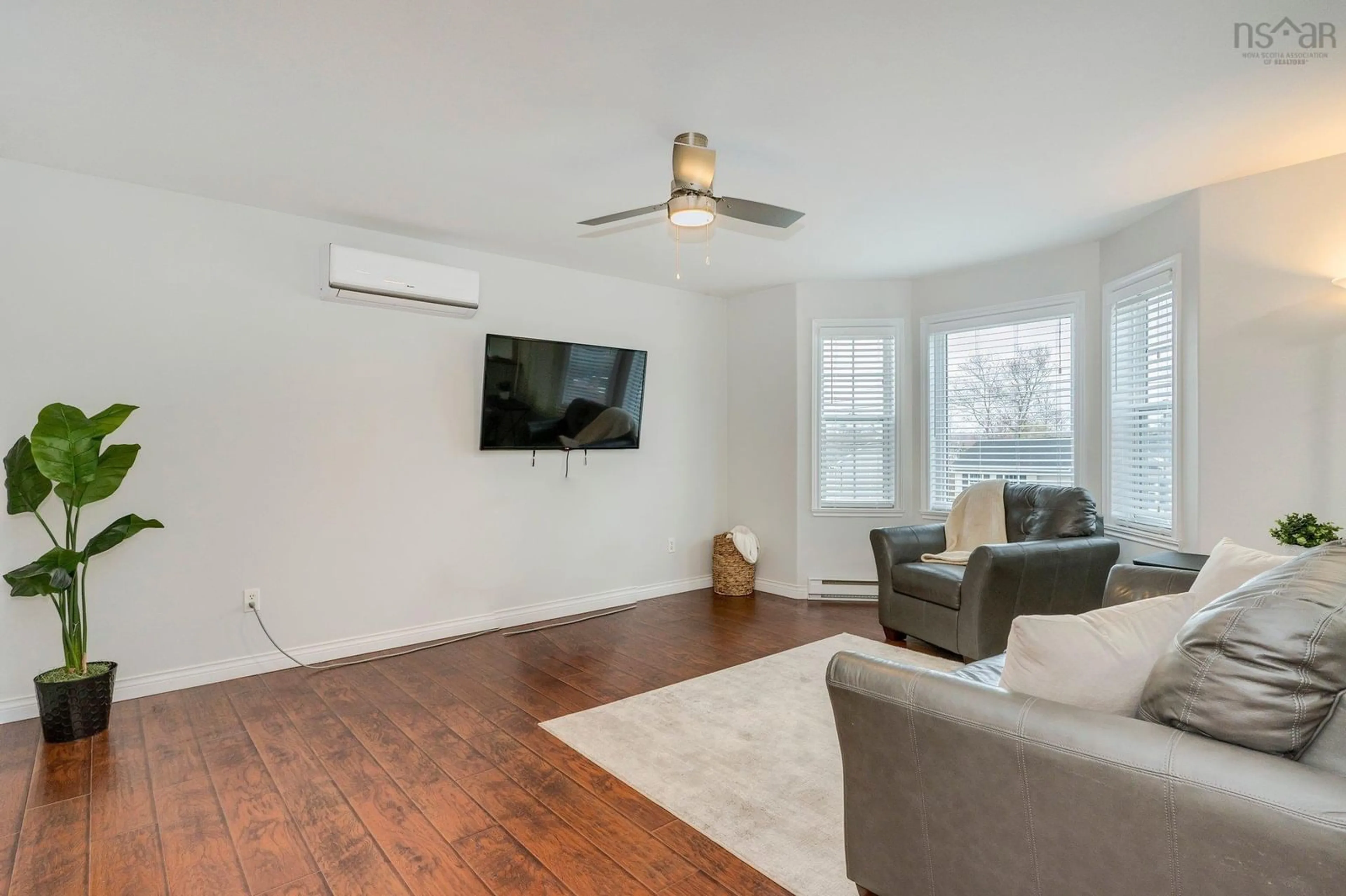 Living room with furniture, wood/laminate floor for 106 Hemlock Dr, Elmsdale Nova Scotia B2S 1B8