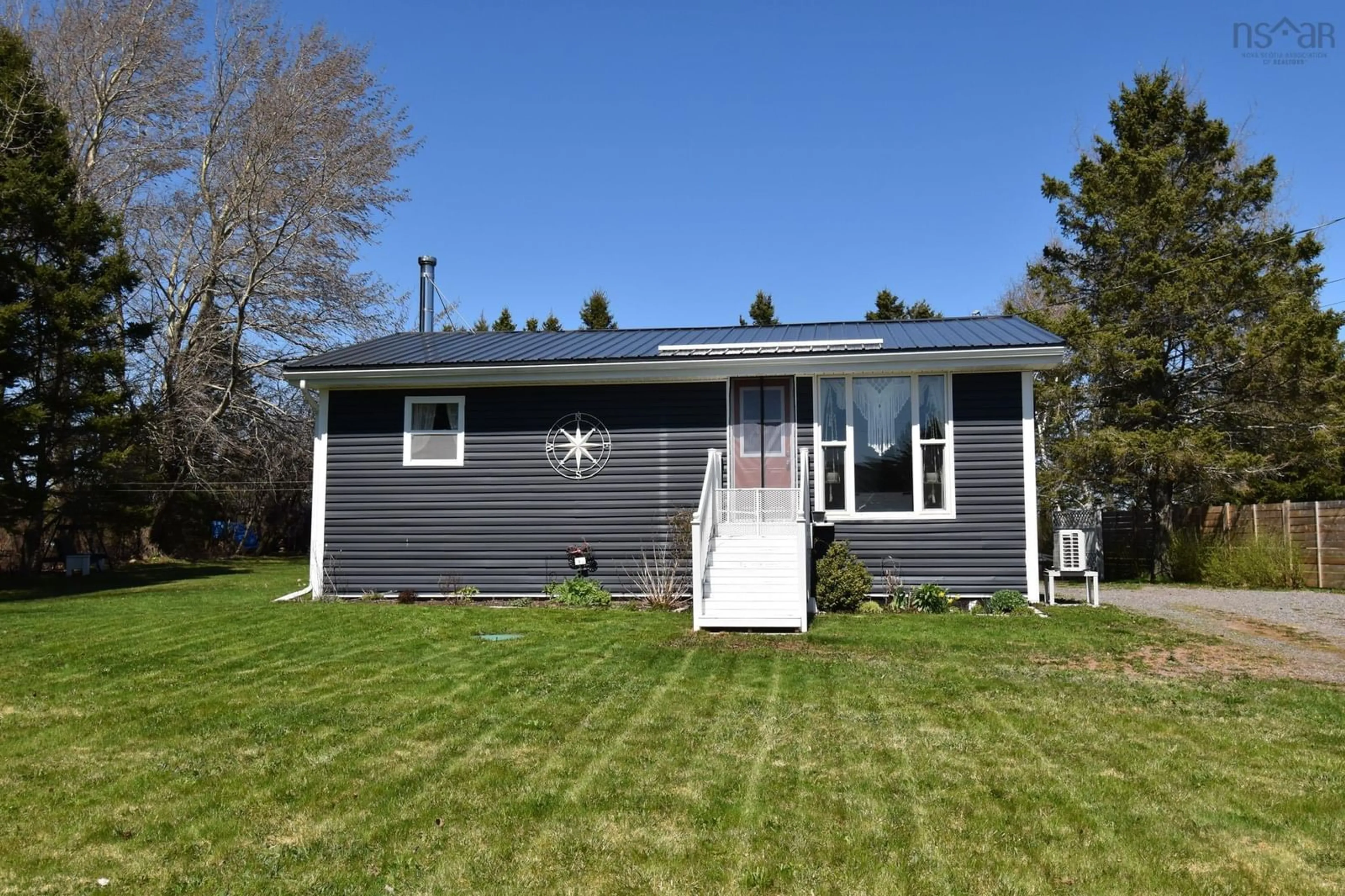 Home with vinyl exterior material, street for 683 Shore Rd, Masstown Nova Scotia B0M 1G0