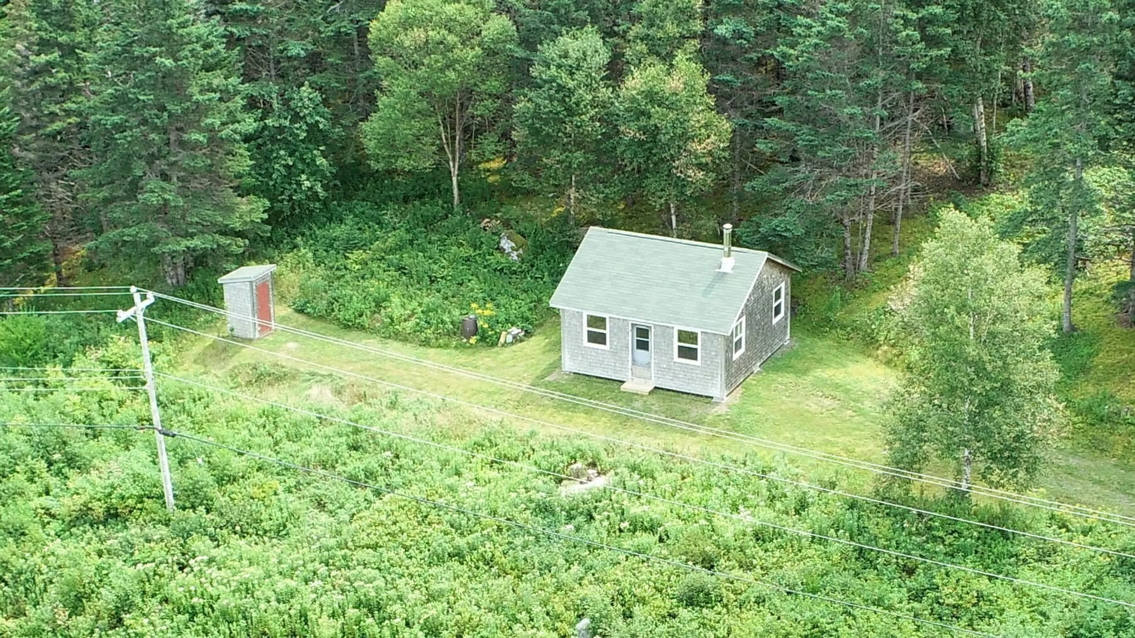 A pic from outside/outdoor area/front of a property/back of a property/a pic from drone, forest/trees view for 6989 Highway 16, Halfway Cove Nova Scotia B0H 1N0