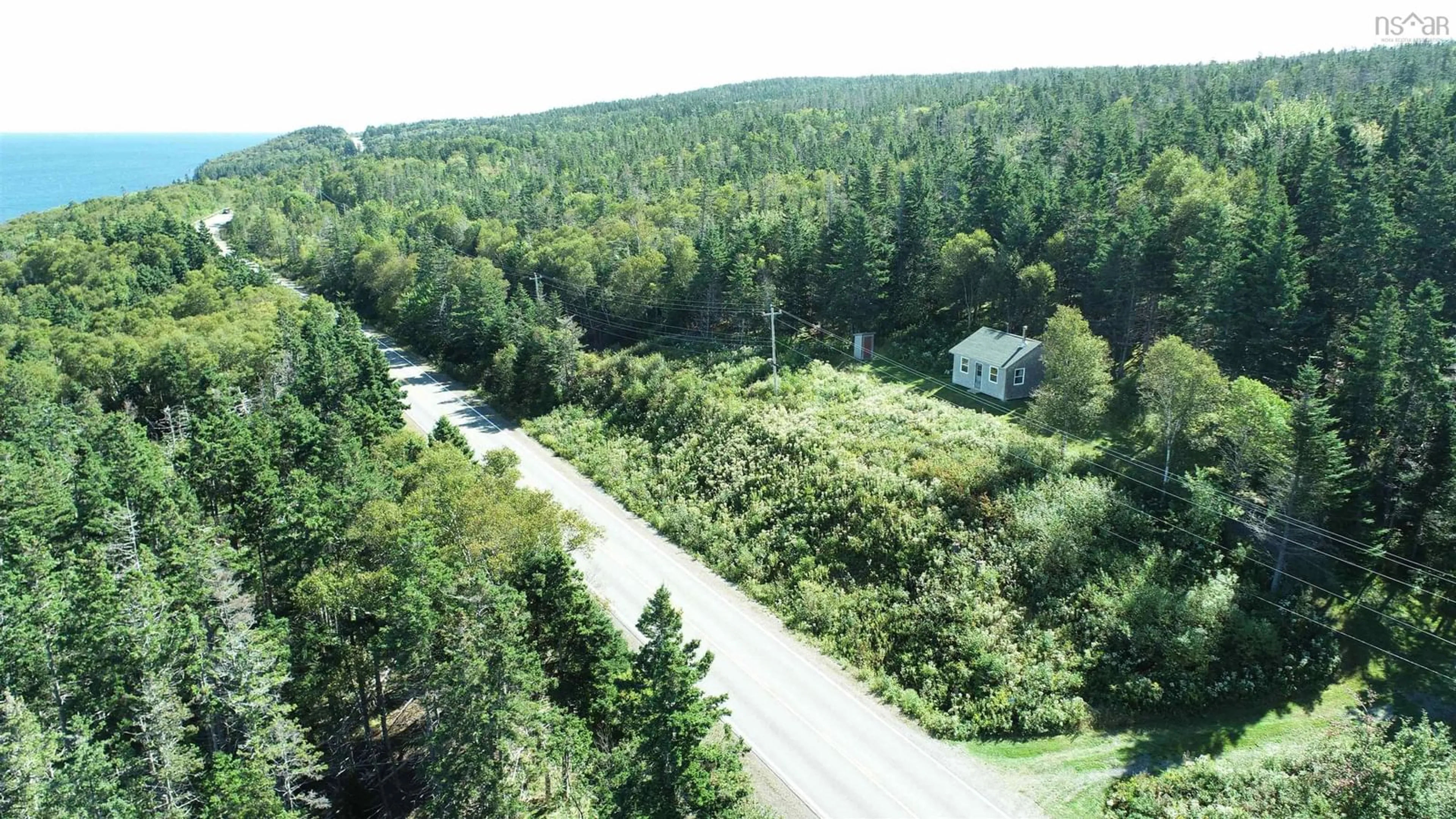 A pic from outside/outdoor area/front of a property/back of a property/a pic from drone, forest/trees view for 6989 Highway 16, Halfway Cove Nova Scotia B0H 1N0
