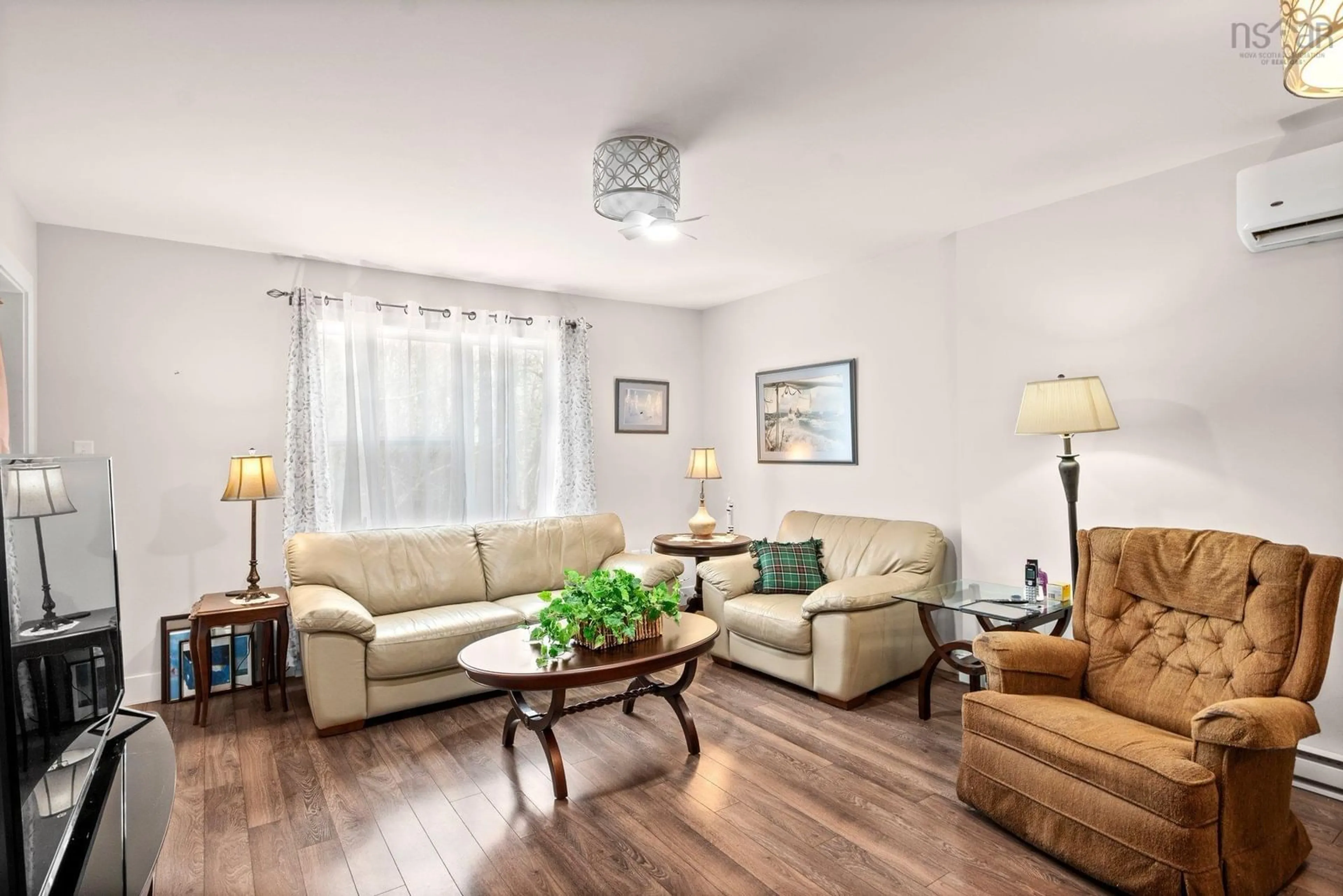 Living room with furniture, wood/laminate floor for 76 Crossfield Ridge, Middle Sackville Nova Scotia B4E 0N2