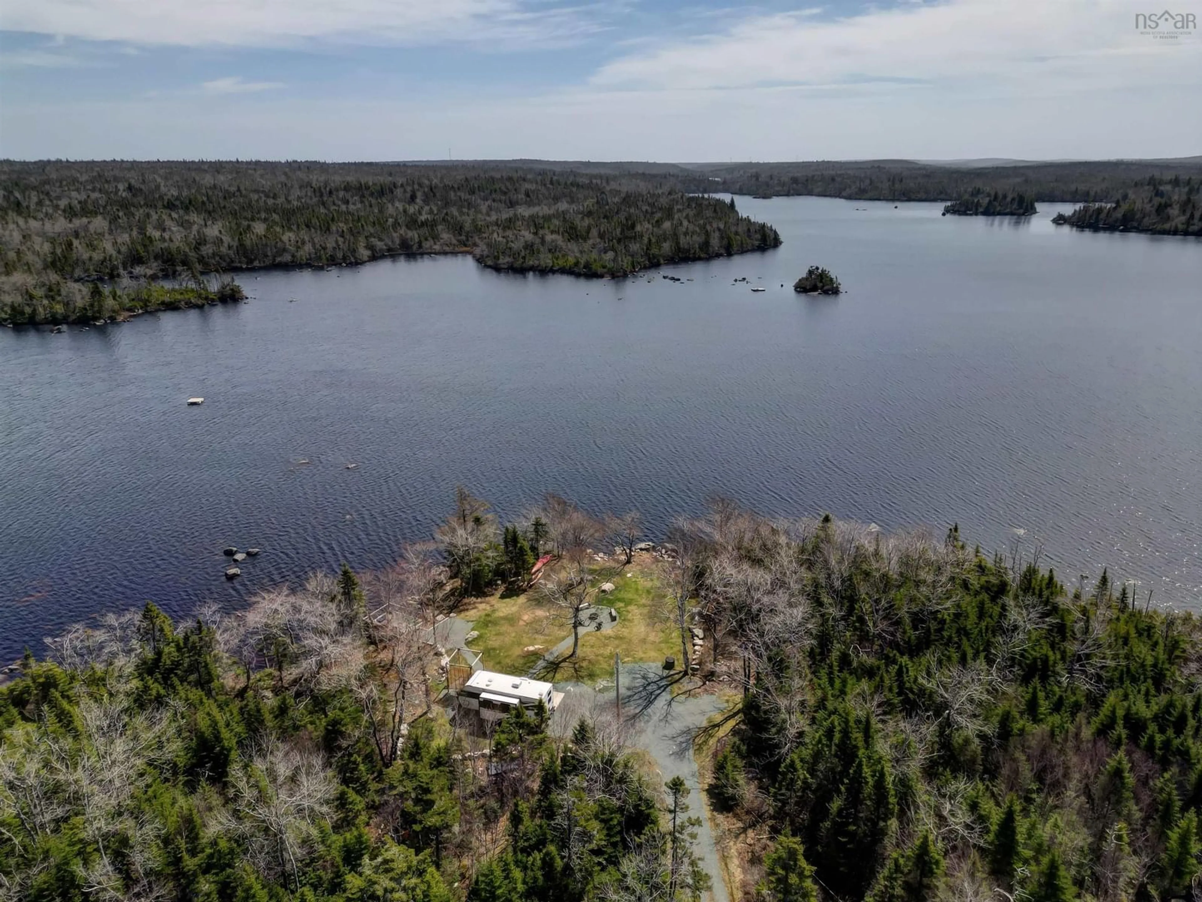 A pic from outside/outdoor area/front of a property/back of a property/a pic from drone, water/lake/river/ocean view for 197 Peters Lake Rd, Hatchet Lake Nova Scotia B3T 1P6