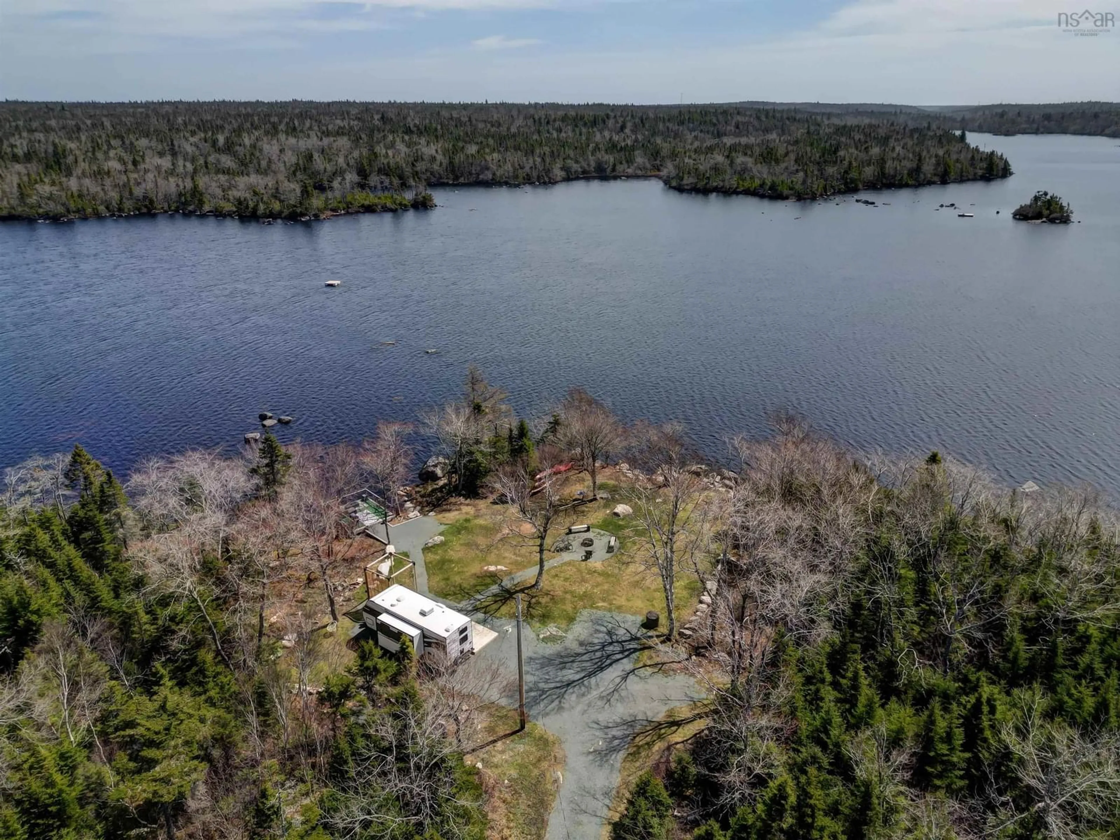 A pic from outside/outdoor area/front of a property/back of a property/a pic from drone, water/lake/river/ocean view for 197 Peters Lake Rd, Hatchet Lake Nova Scotia B3T 1P6