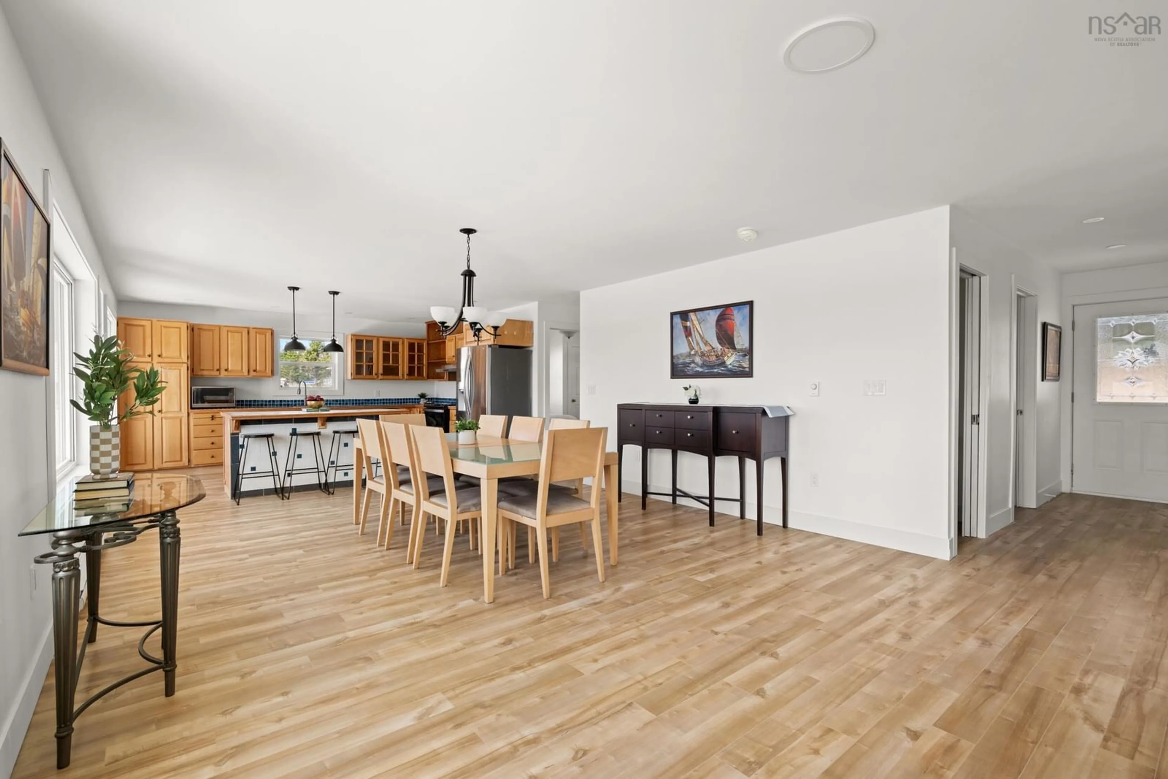 Open concept kitchen, wood/laminate floor for 24986 Nova Scotia Trunk 7, Port Dufferin Nova Scotia B0K 2R0