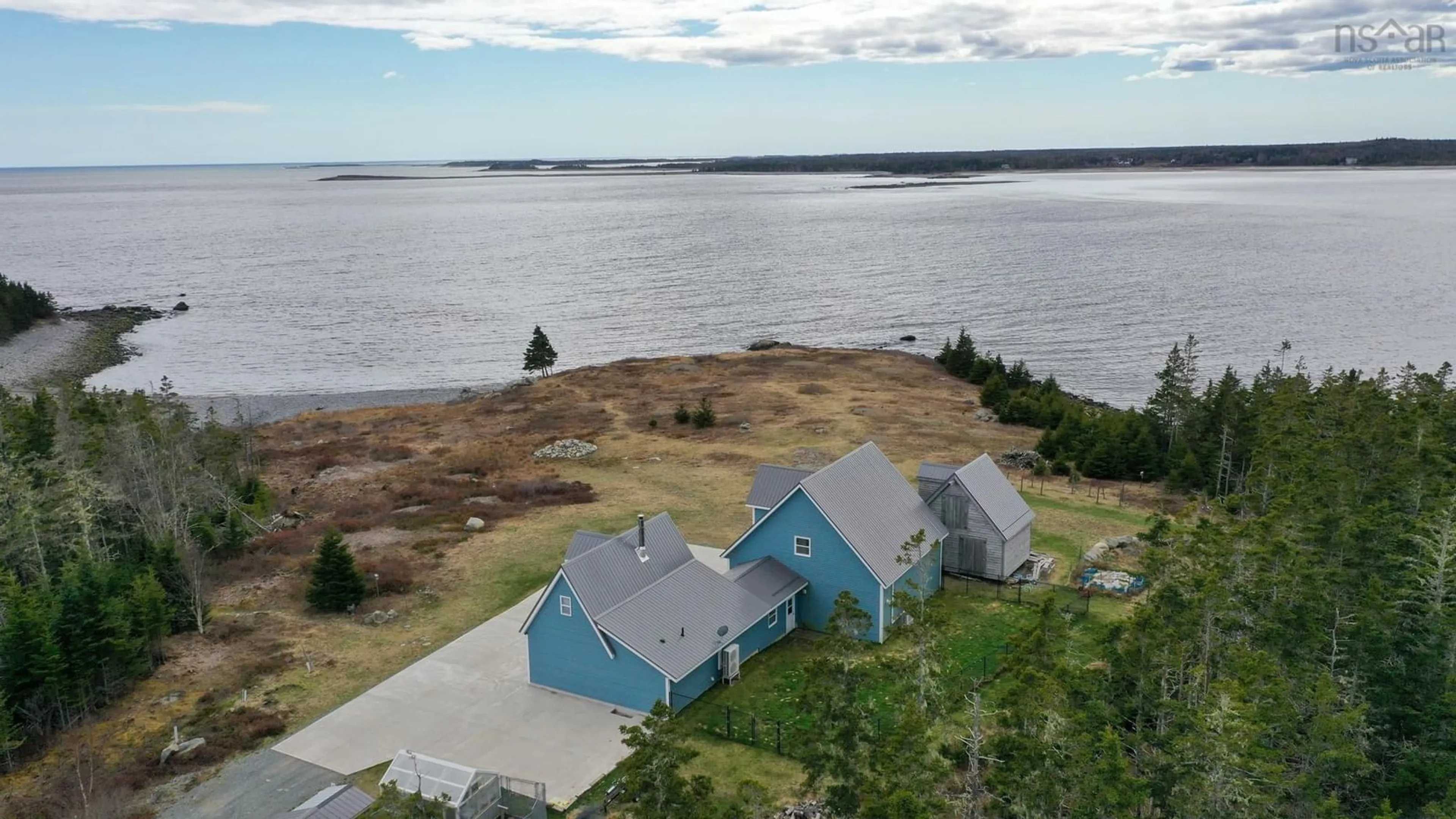 A pic from outside/outdoor area/front of a property/back of a property/a pic from drone, water/lake/river/ocean view for 385 Hook Point Rd, East Sable River Nova Scotia B0T 1V0