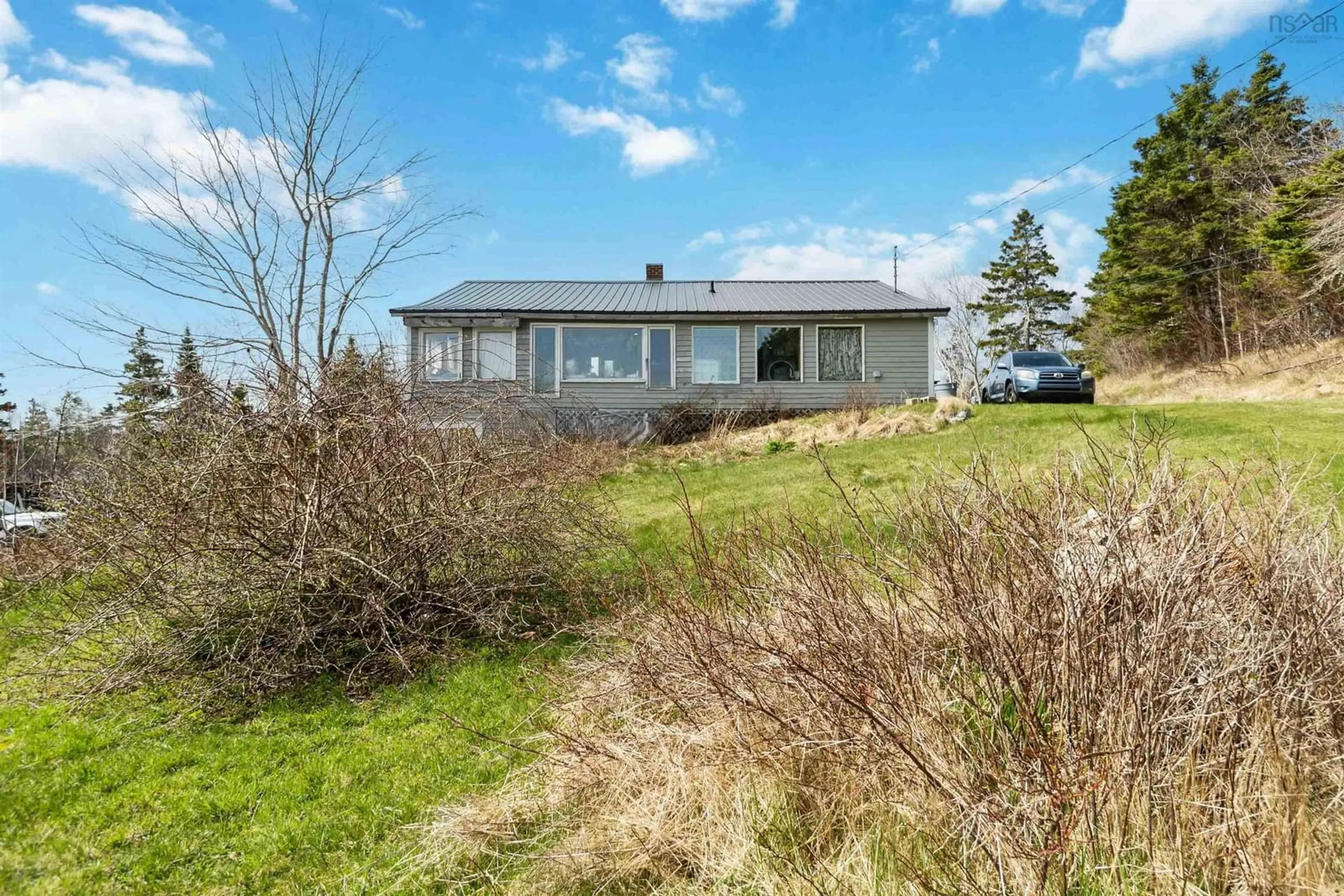 A pic from outside/outdoor area/front of a property/back of a property/a pic from drone, water/lake/river/ocean view for 8169 Highway 331, Cherry Hill Nova Scotia B0J 2H0