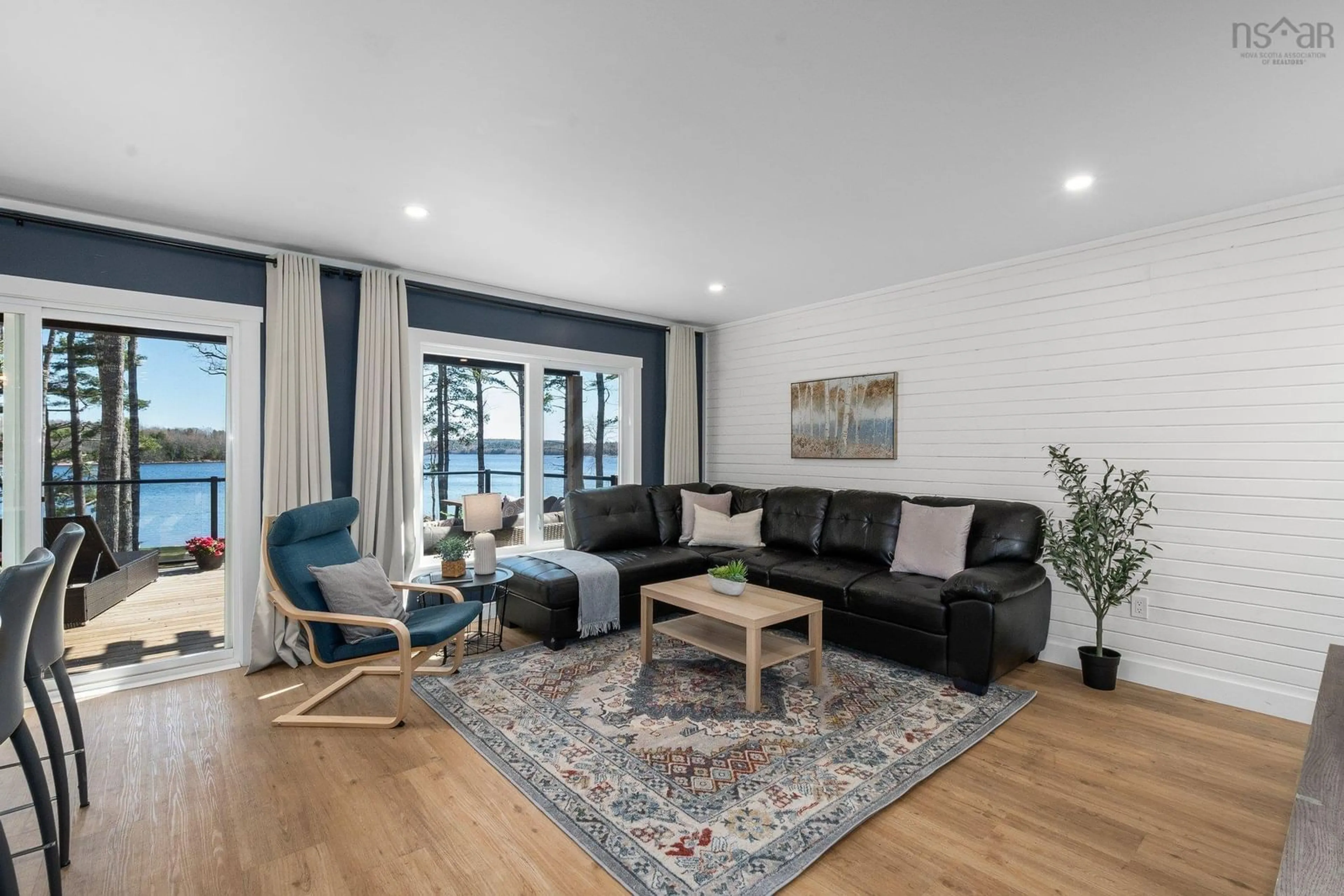 Living room with furniture, wood/laminate floor for 96 Canyon Point, Falls Lake Nova Scotia B0N 2T0