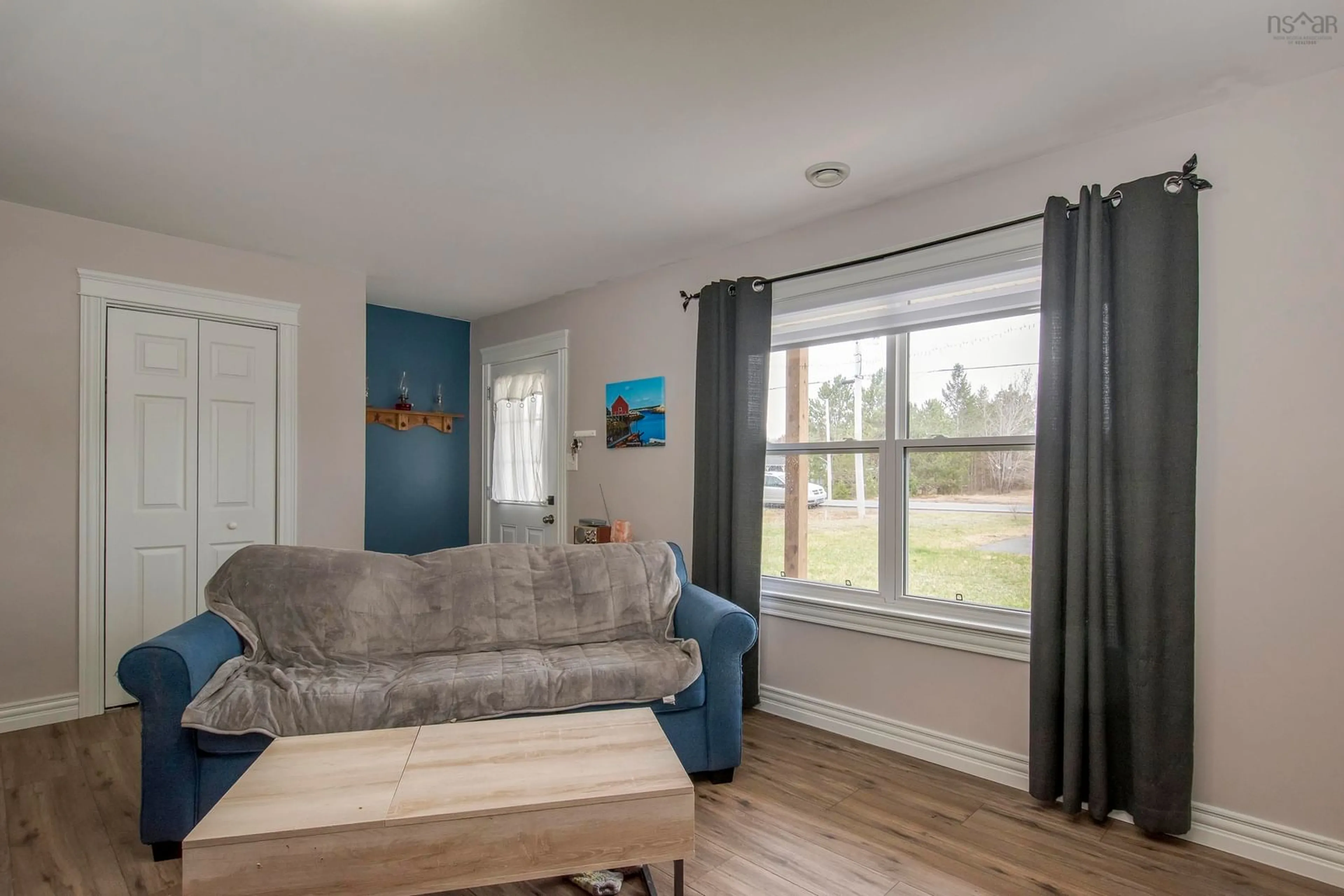 Living room with furniture, wood/laminate floor for 2206/2208 Highway 201, Greenwood Square Nova Scotia B0P 1R0