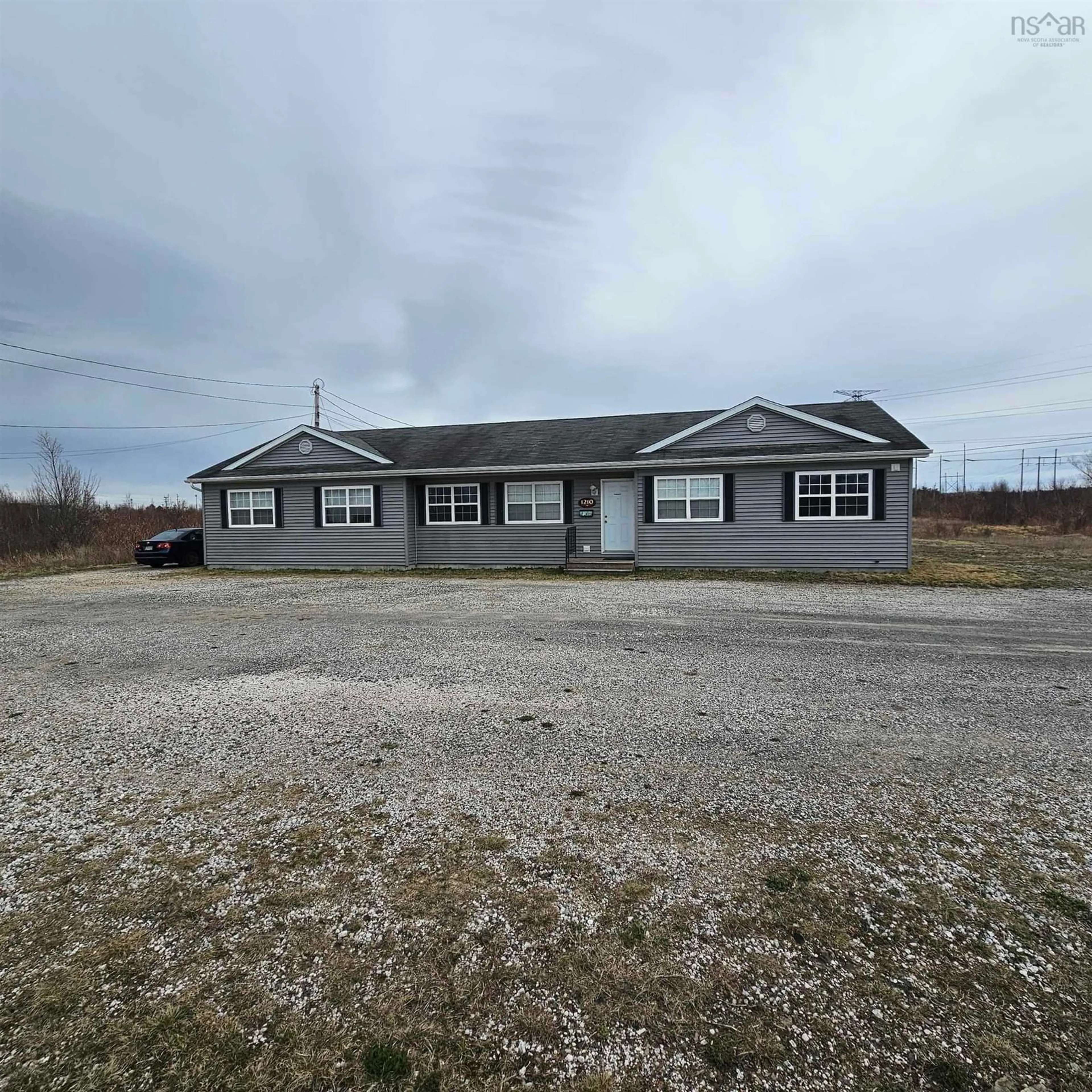 A pic from outside/outdoor area/front of a property/back of a property/a pic from drone, building for 1210 Grand Lake Rd, Sydney Nova Scotia B1M 1A2