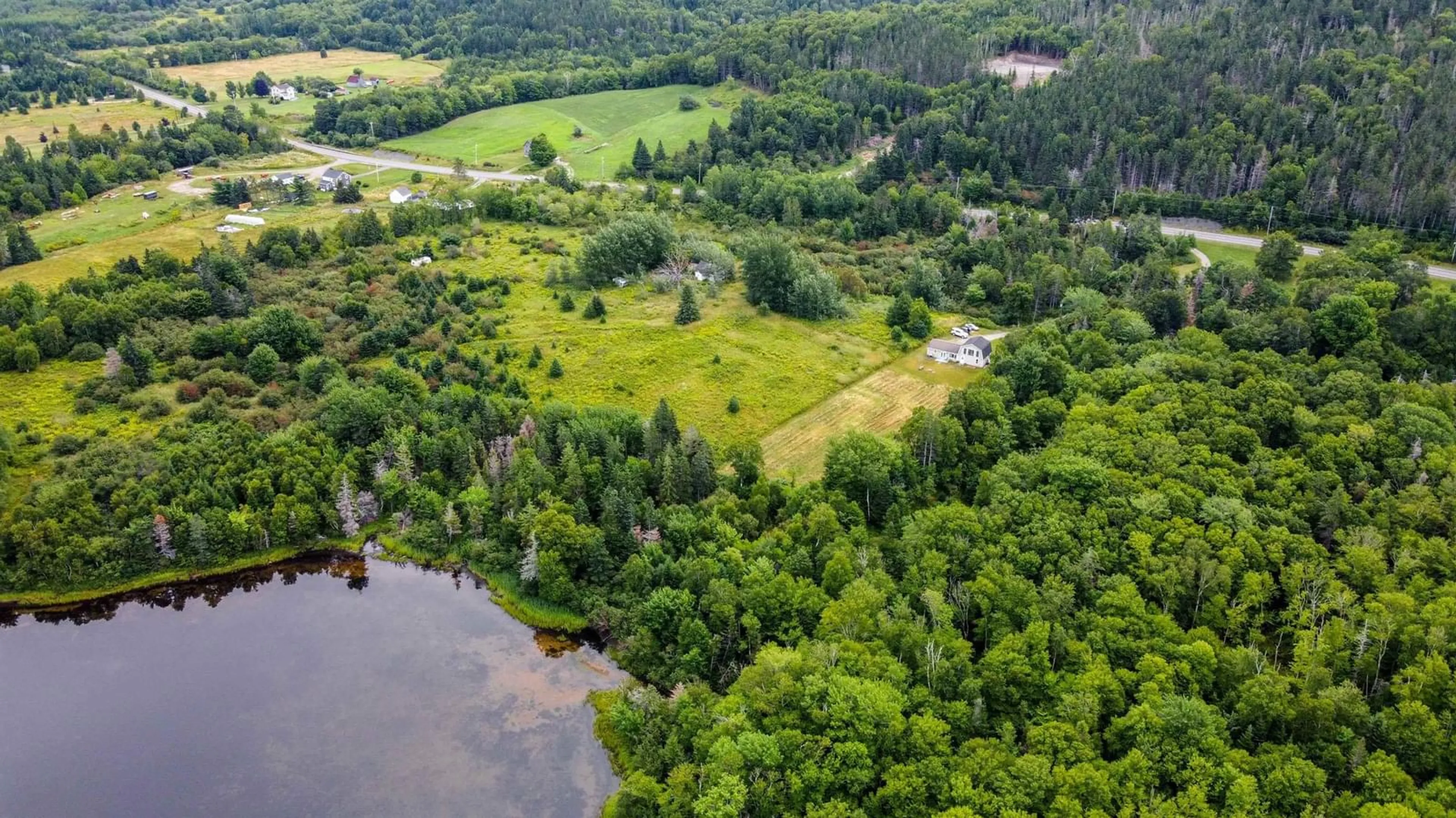 A pic from outside/outdoor area/front of a property/back of a property/a pic from drone, water/lake/river/ocean view for 8004 East Bay Highway, Big Pond Centre Nova Scotia B1J 1Z4