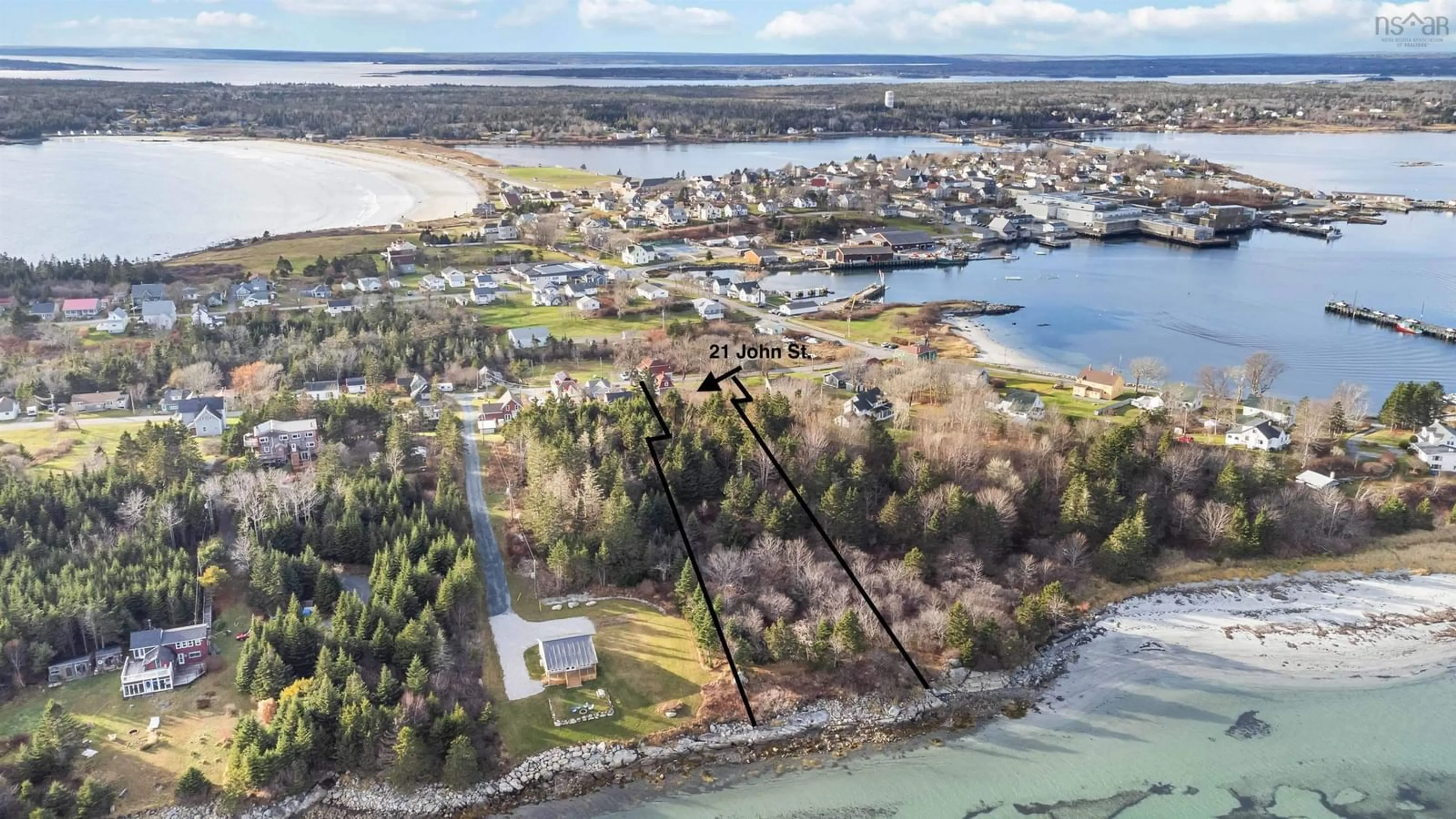 A pic from outside/outdoor area/front of a property/back of a property/a pic from drone, water/lake/river/ocean view for 21 John St, Lockeport Nova Scotia B0T 1L0