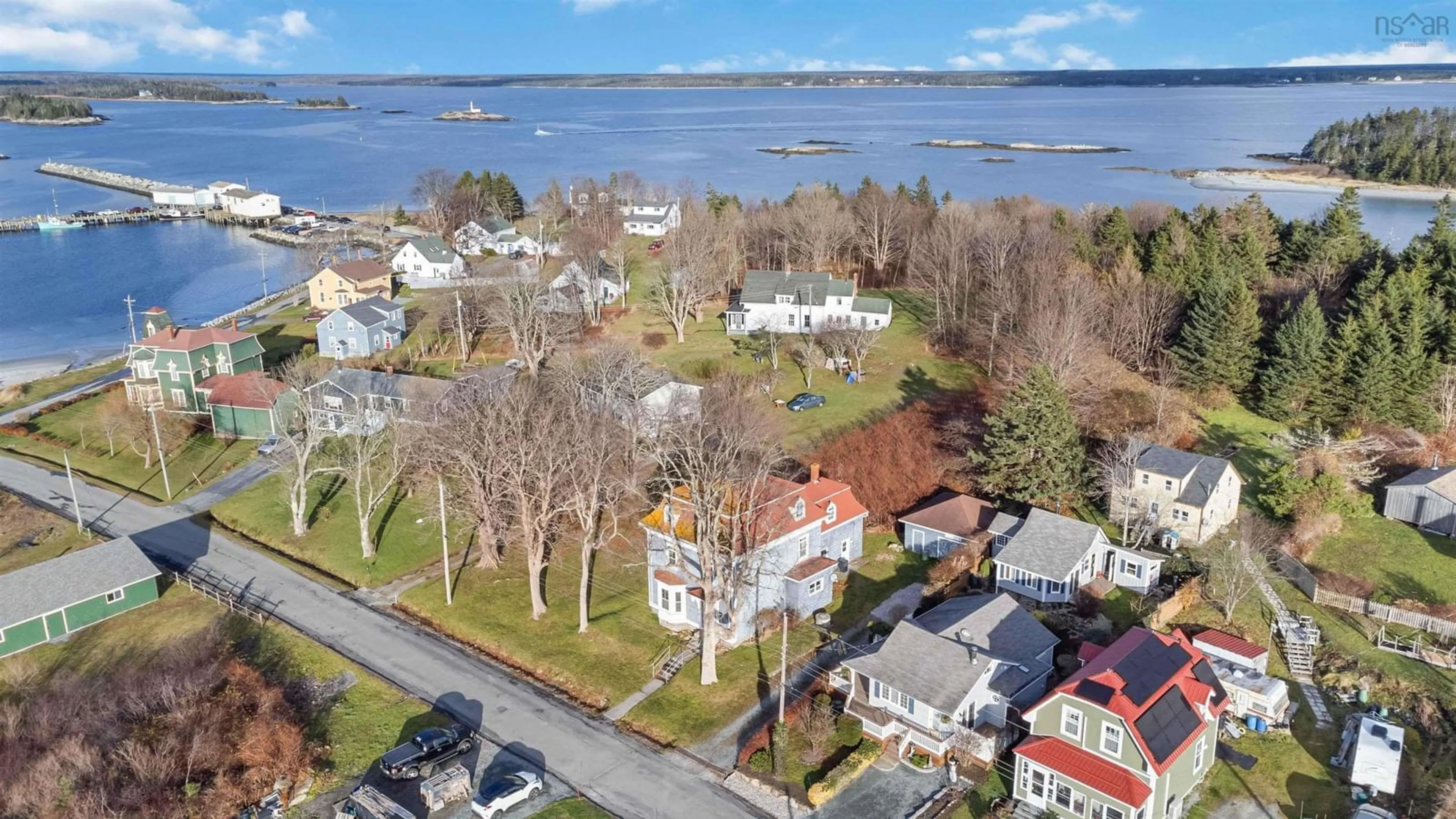 A pic from outside/outdoor area/front of a property/back of a property/a pic from drone, water/lake/river/ocean view for 21 John St, Lockeport Nova Scotia B0T 1L0