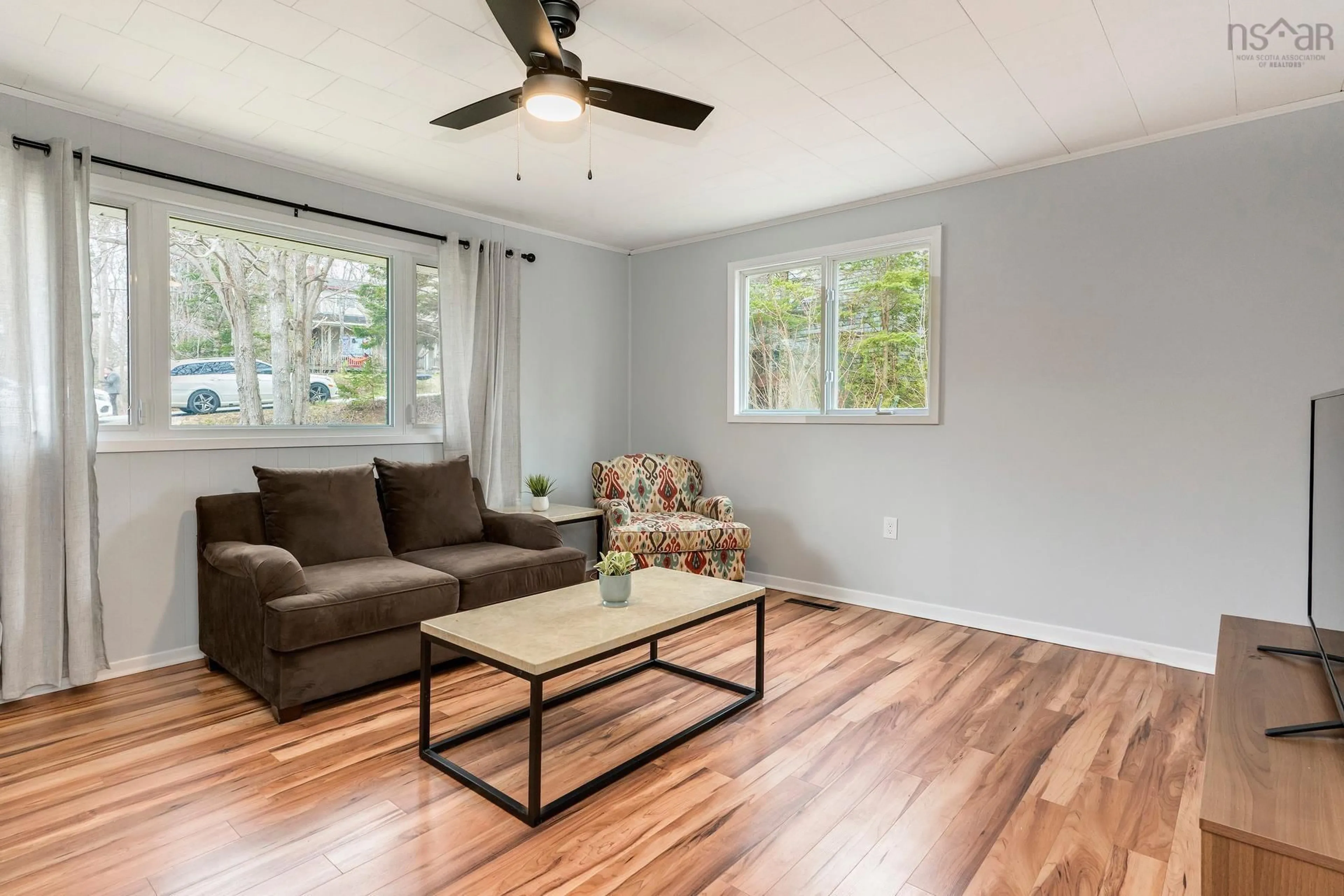 Living room with furniture, wood/laminate floor for 3 Roland Ave, Timberlea Nova Scotia B3T 1G9