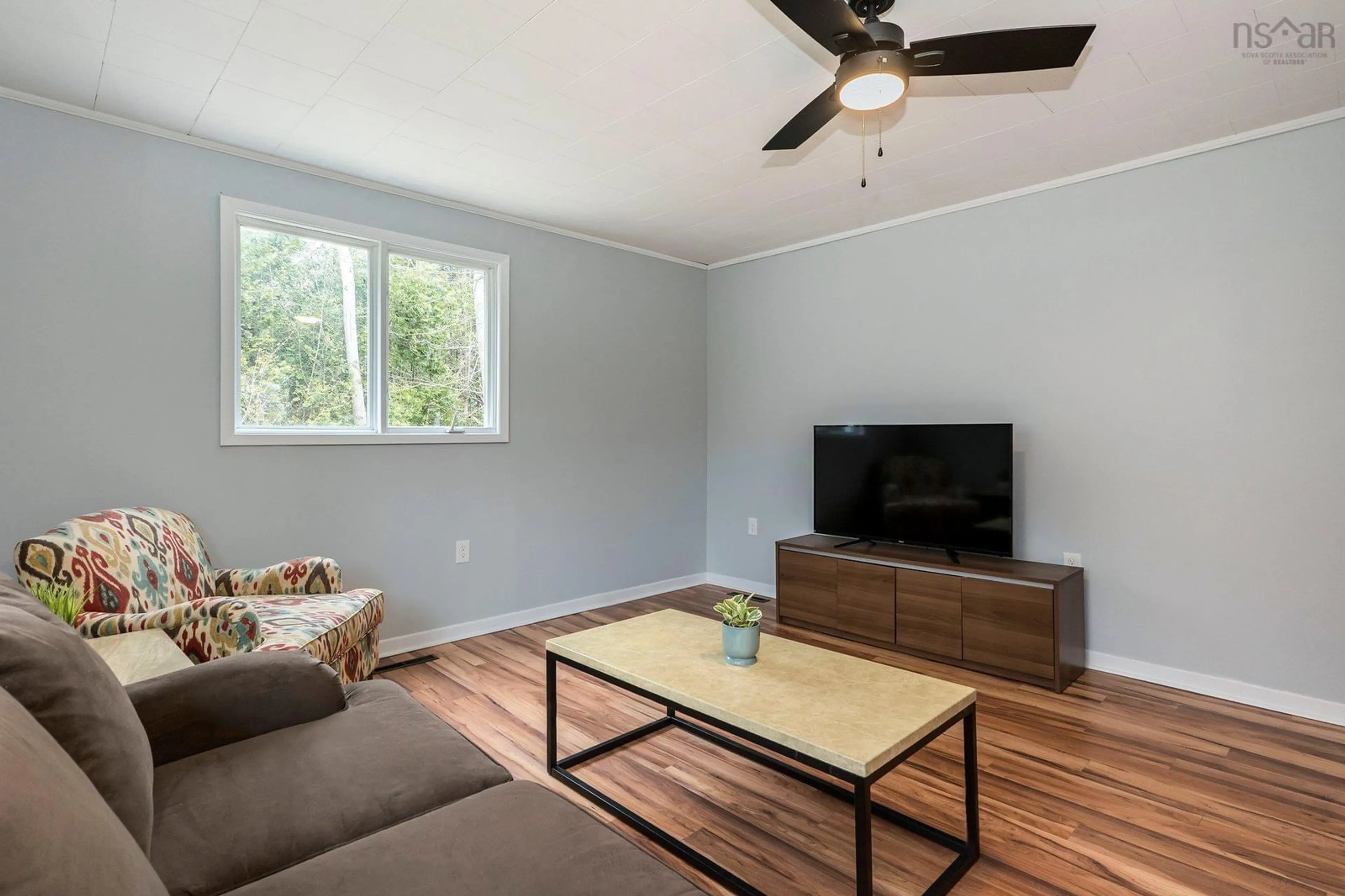 Living room with furniture, wood/laminate floor for 3 Roland Ave, Timberlea Nova Scotia B3T 1G9