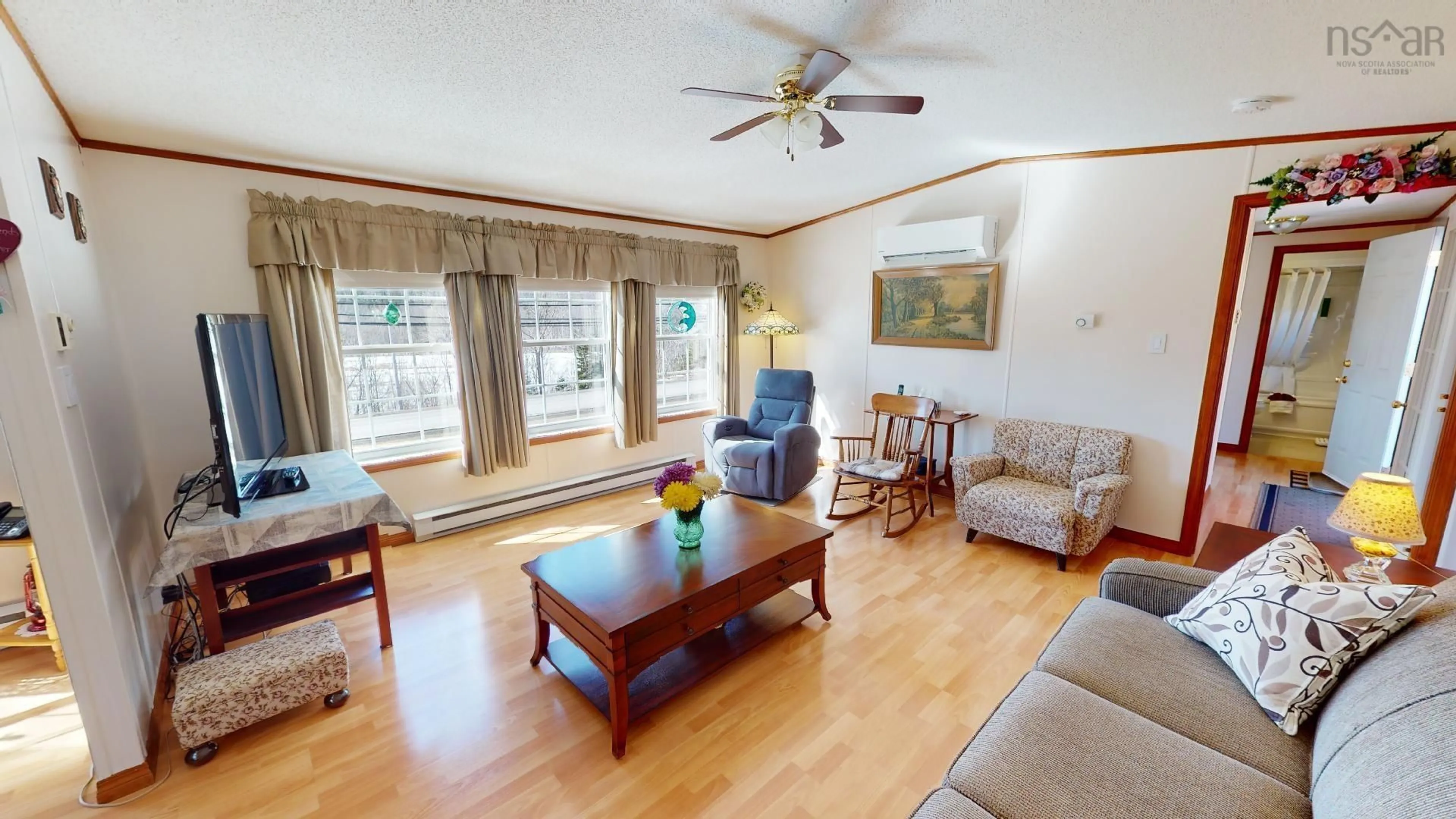 Living room with furniture, wood/laminate floor for 310 & 312 Highway 252, Churchview Nova Scotia B0E 3M0