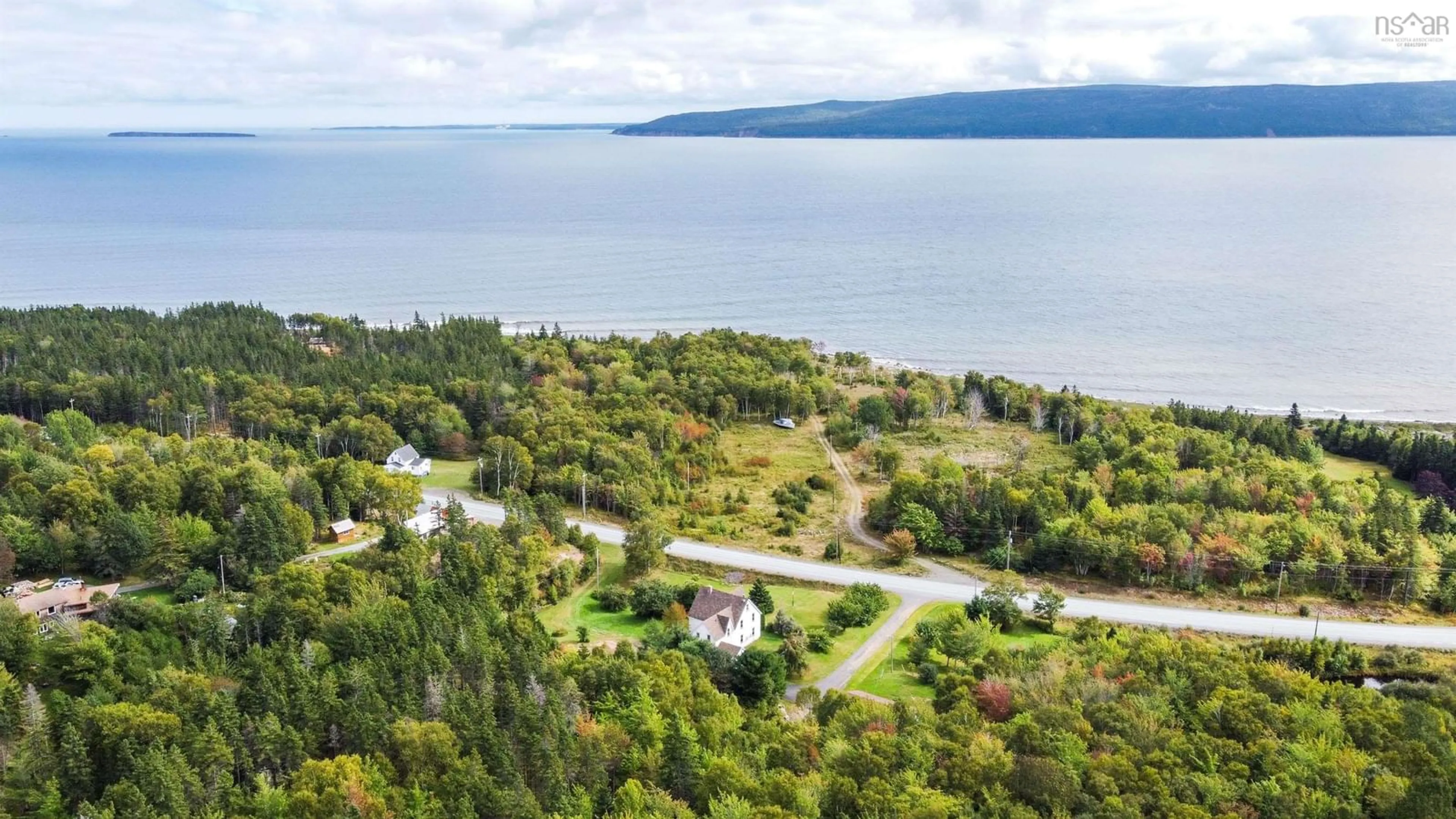 A pic from outside/outdoor area/front of a property/back of a property/a pic from drone, water/lake/river/ocean view for 45832 Cabot Trail, Indian Brook Nova Scotia B0C 1H0