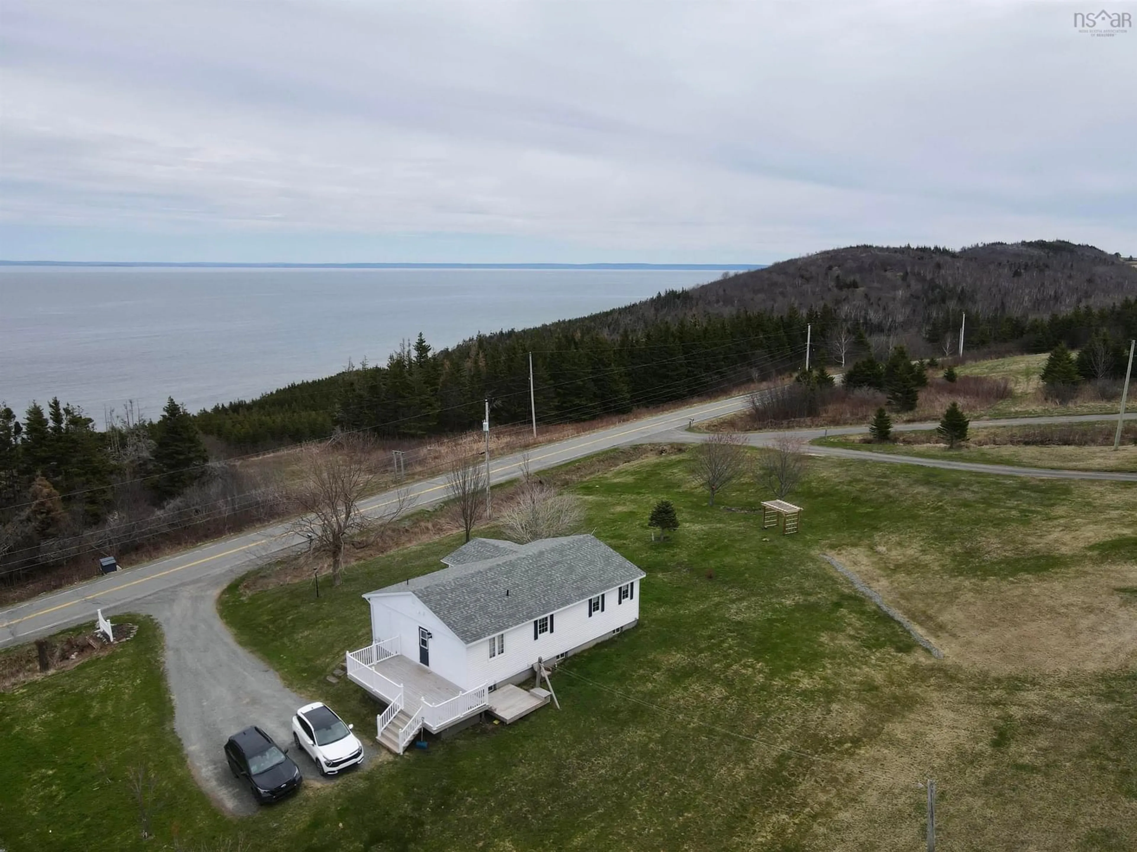 A pic from outside/outdoor area/front of a property/back of a property/a pic from drone, water/lake/river/ocean view for 7061 Highway 337, Cape George Point Nova Scotia B2G 2L2