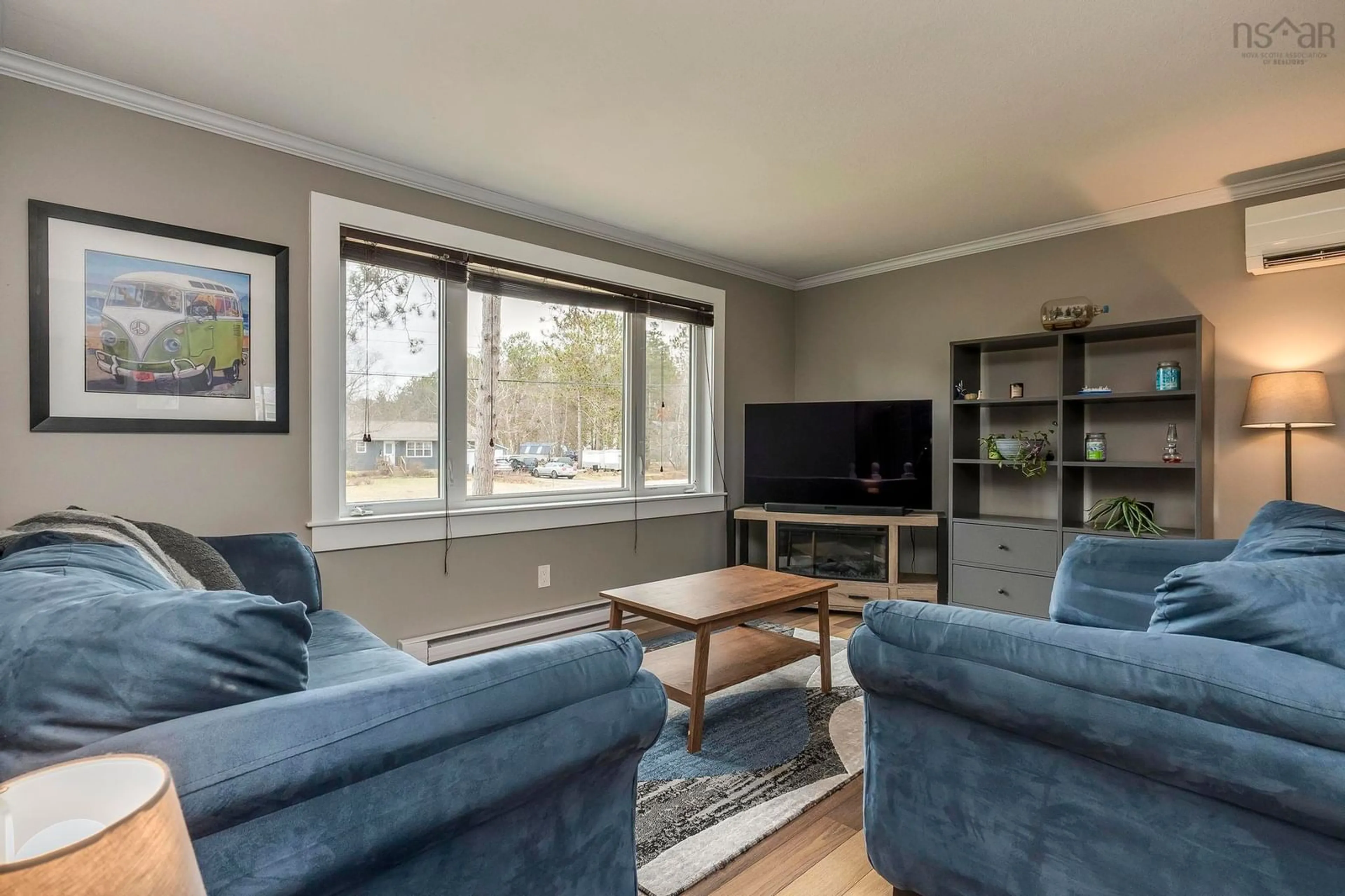 Living room with furniture, wood/laminate floor for 65 Valley Rd, Wilmot Nova Scotia B0P 1R0