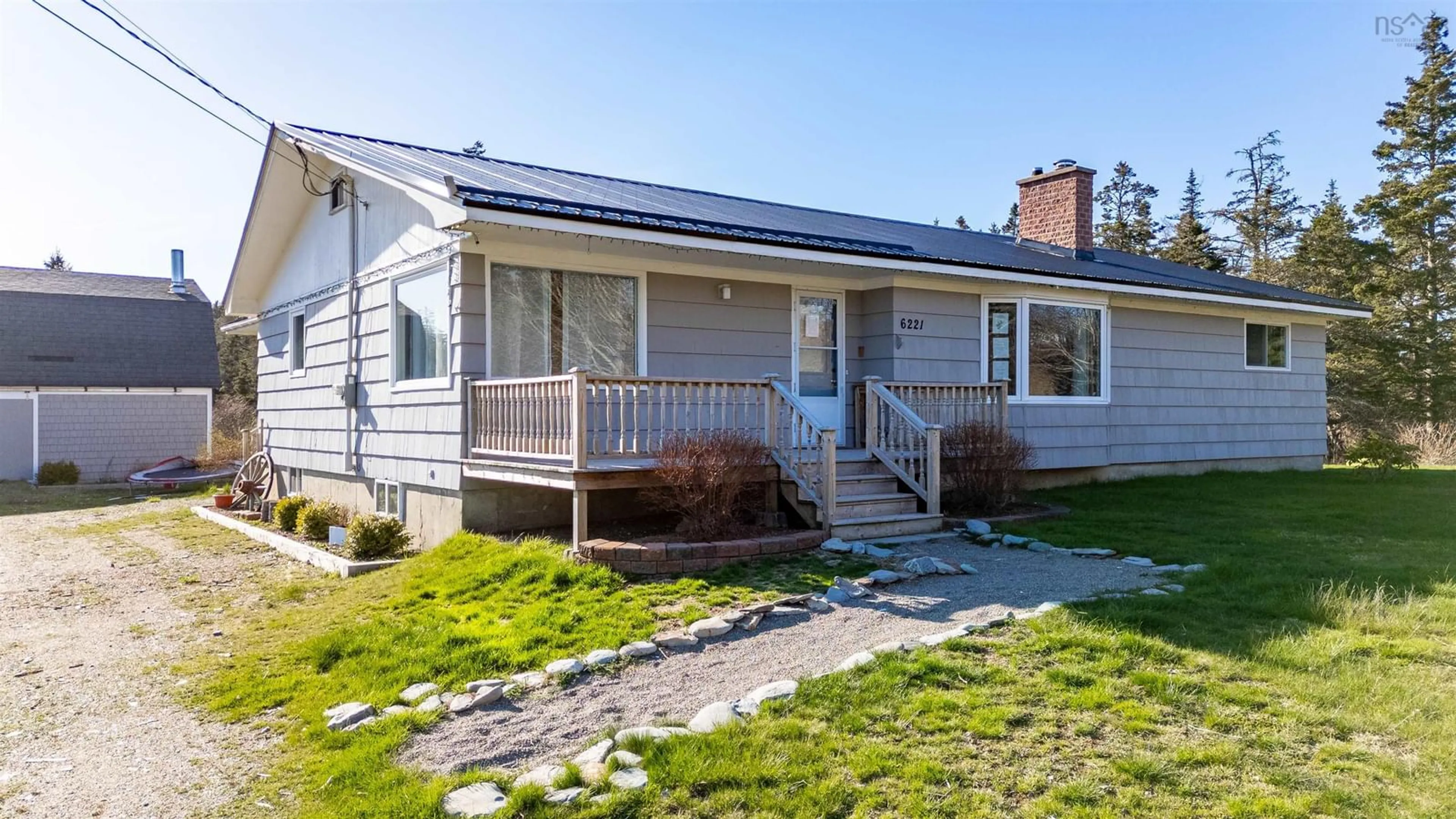 Home with vinyl exterior material, street for 6221 1 Hwy, Mavillette Nova Scotia B0W 2H0