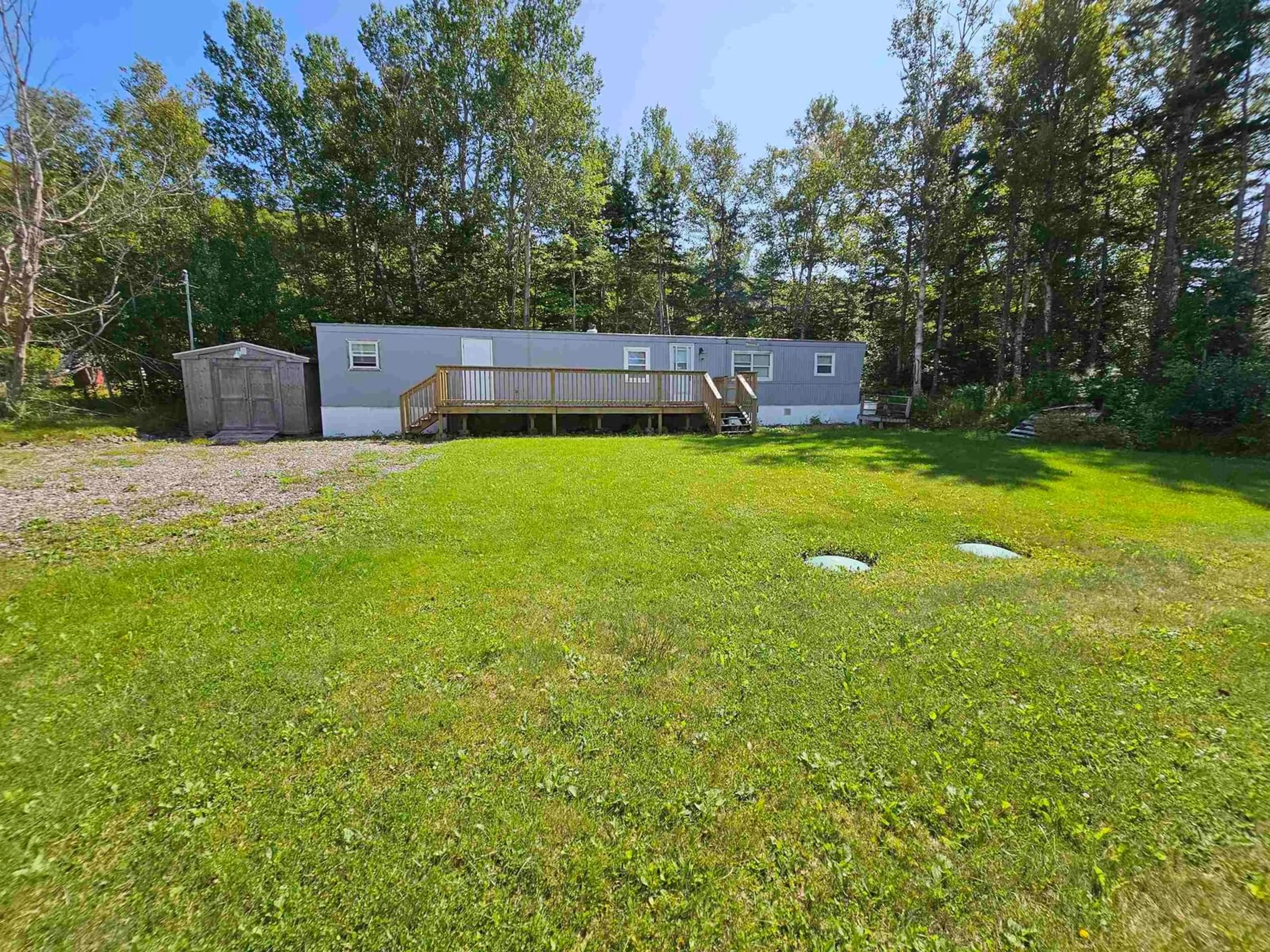 A pic from outside/outdoor area/front of a property/back of a property/a pic from drone, forest/trees view for 5 Penny Lane, Big Pond Nova Scotia B1J 1R9