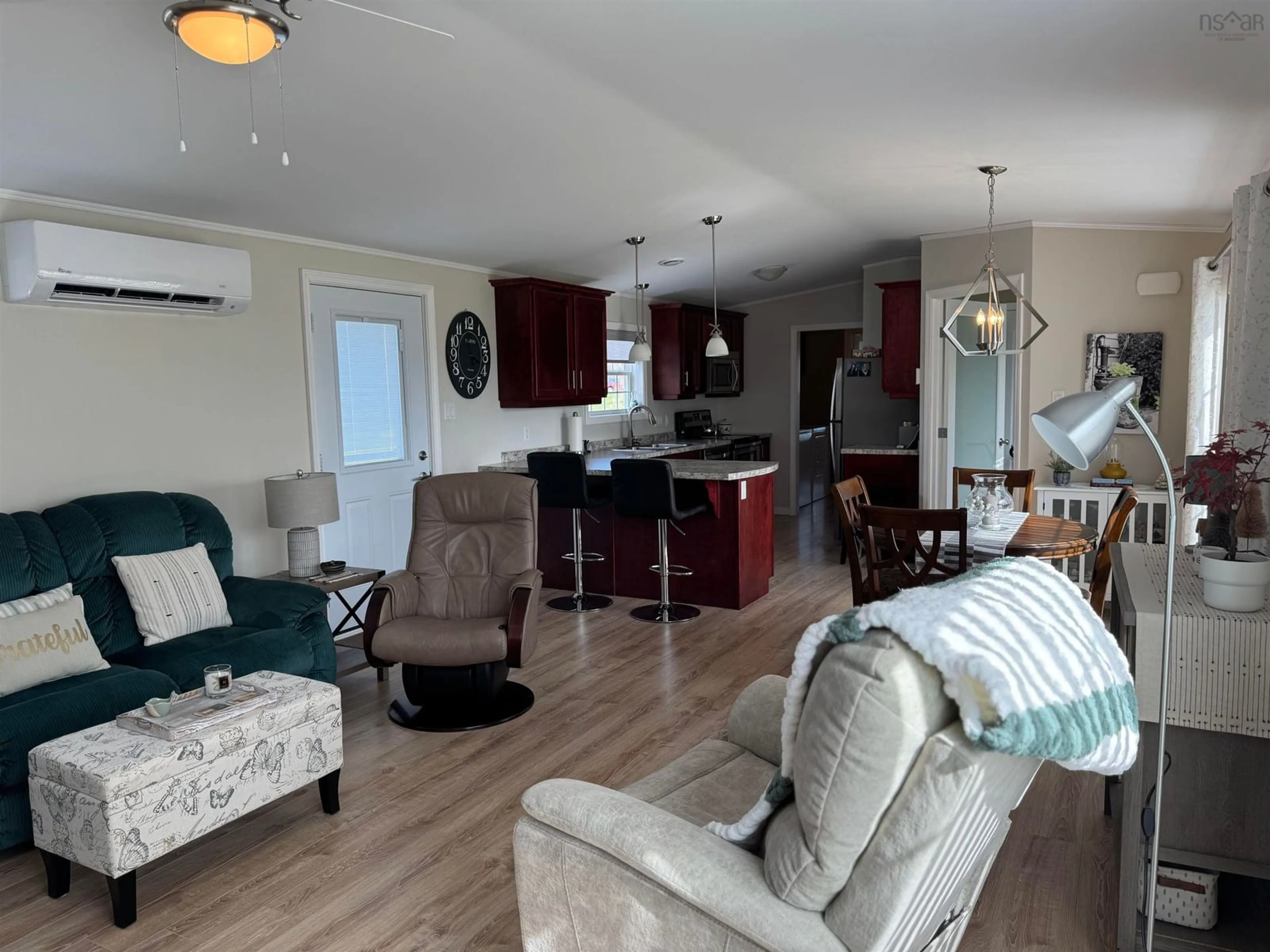 Living room with furniture, wood/laminate floor for 15 Macleod St, Inverness Nova Scotia B0E 1N0