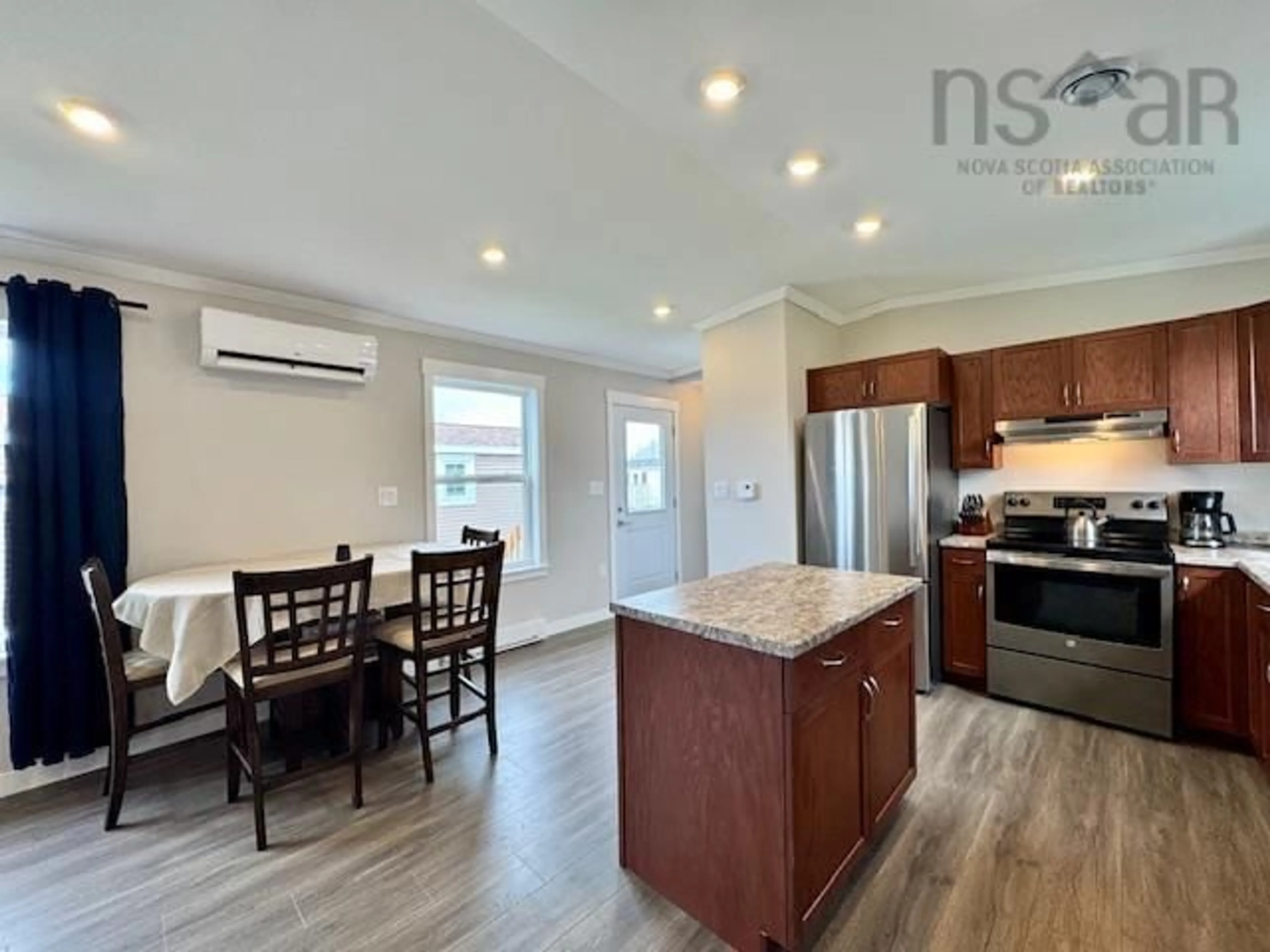 Open concept kitchen, wood/laminate floor for 3 Nathaniel Ave, Mount Uniacke Nova Scotia B0N 1Z0