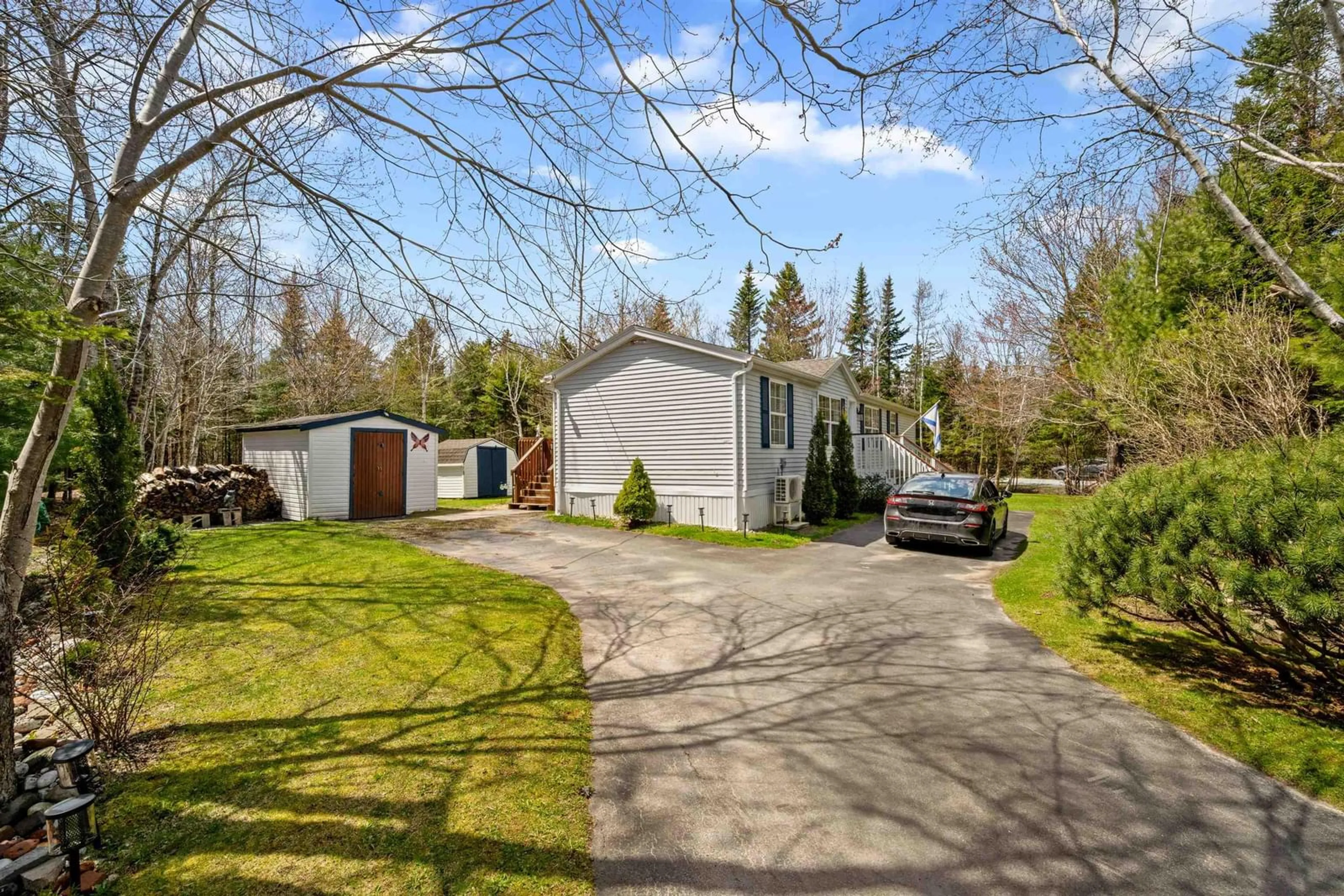 A pic from outside/outdoor area/front of a property/back of a property/a pic from drone, street for 308 Myra Rd, Porters Lake Nova Scotia B3E 1G2