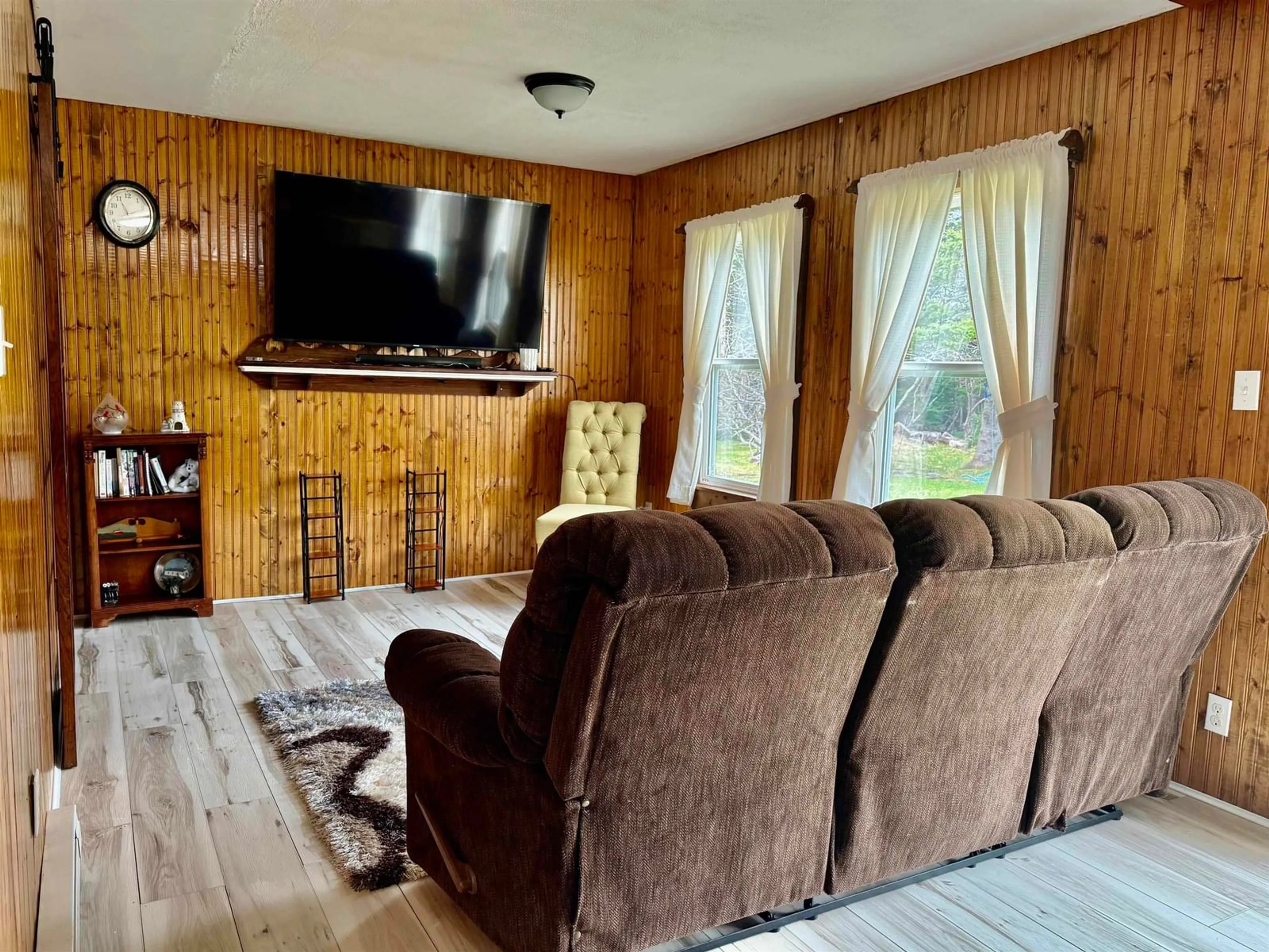 Living room with furniture, wood/laminate floor for 4333 Shore Rd, Ingomar Nova Scotia B0T 1H0