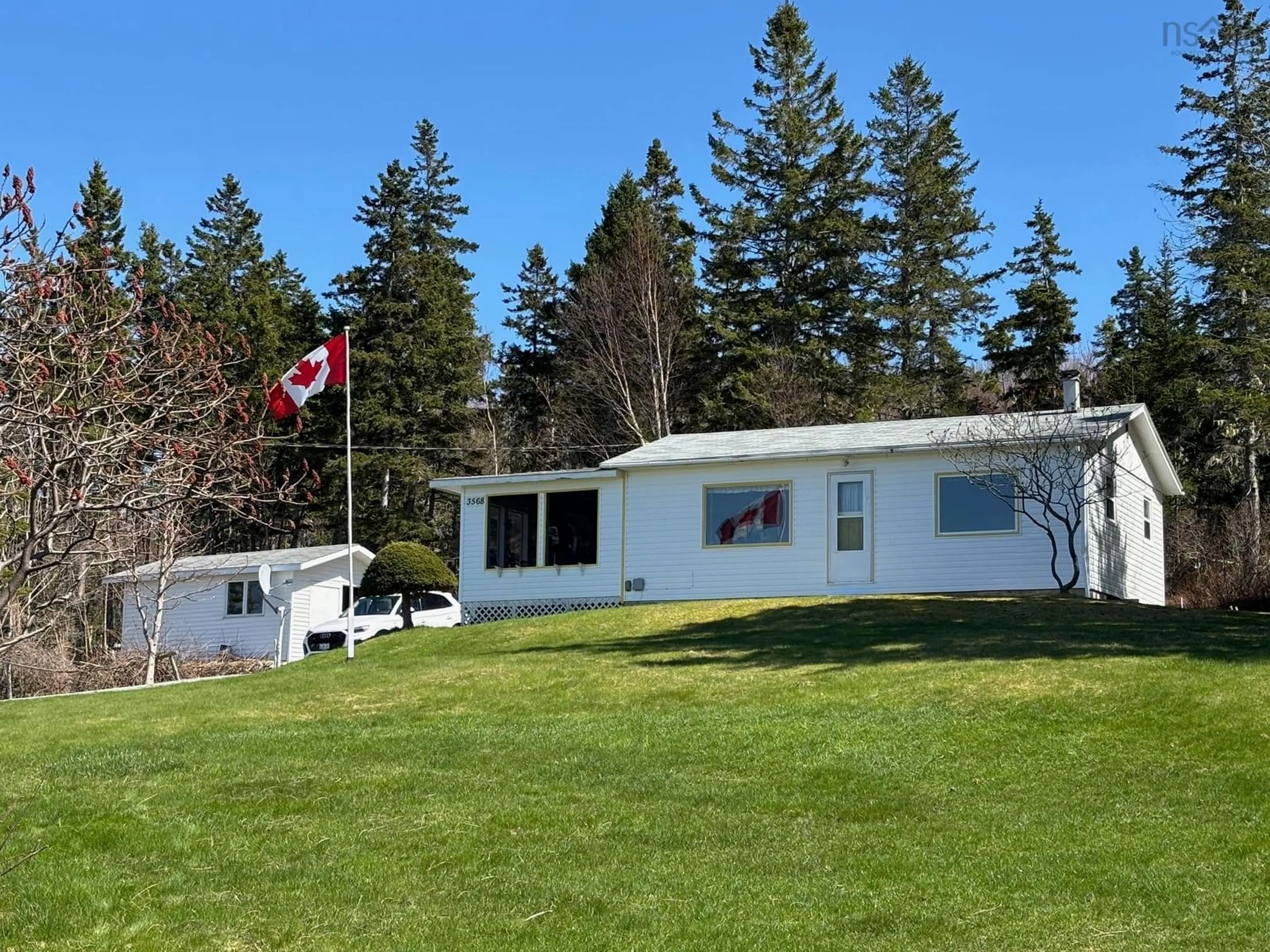 A pic from outside/outdoor area/front of a property/back of a property/a pic from drone, water/lake/river/ocean view for 3568 West Bay Rd, St. Georges Channel Nova Scotia B0E 3K0
