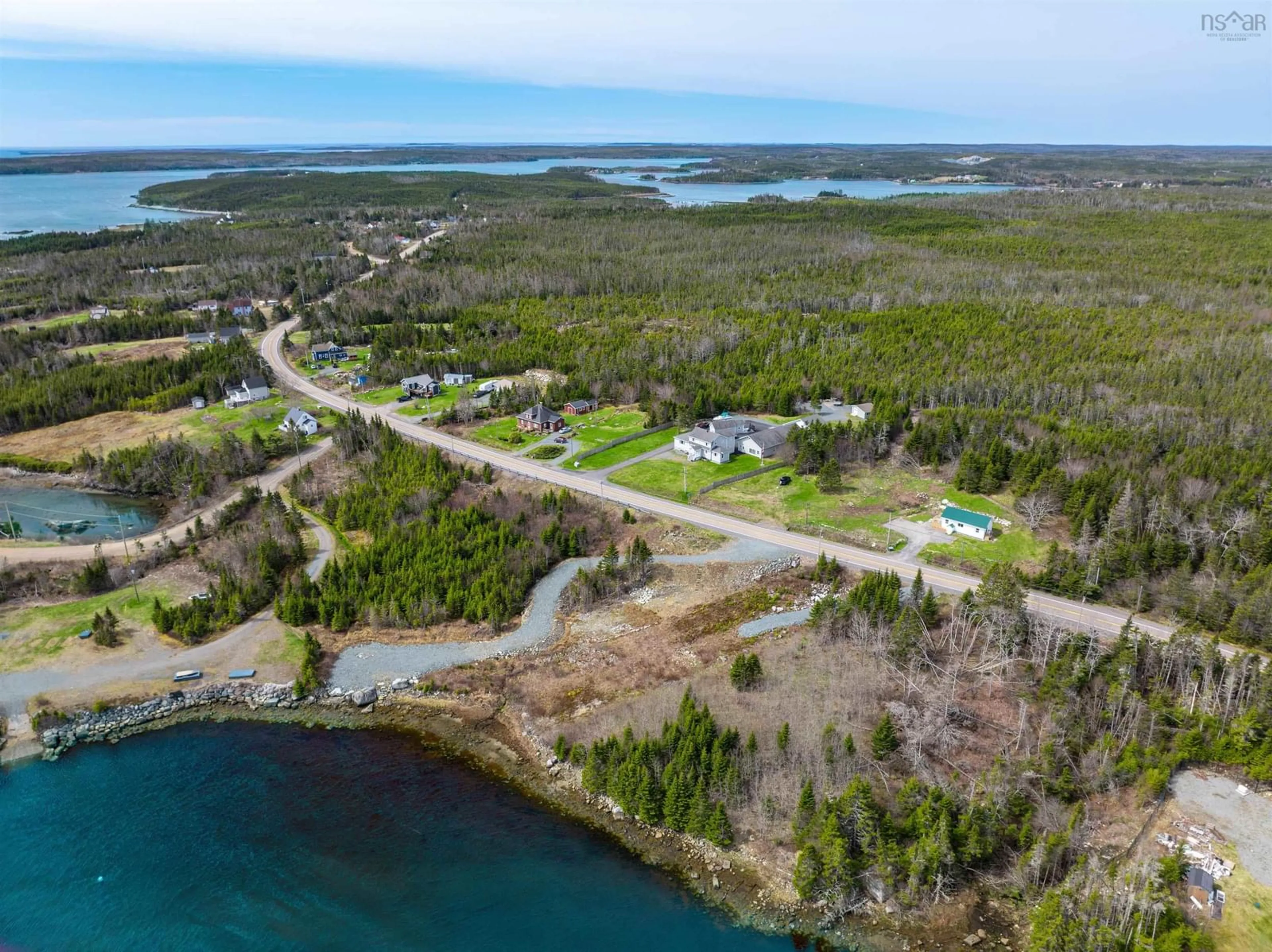 A pic from outside/outdoor area/front of a property/back of a property/a pic from drone, water/lake/river/ocean view for 5067 7 Highway, Liscomb Nova Scotia B0J 2A0