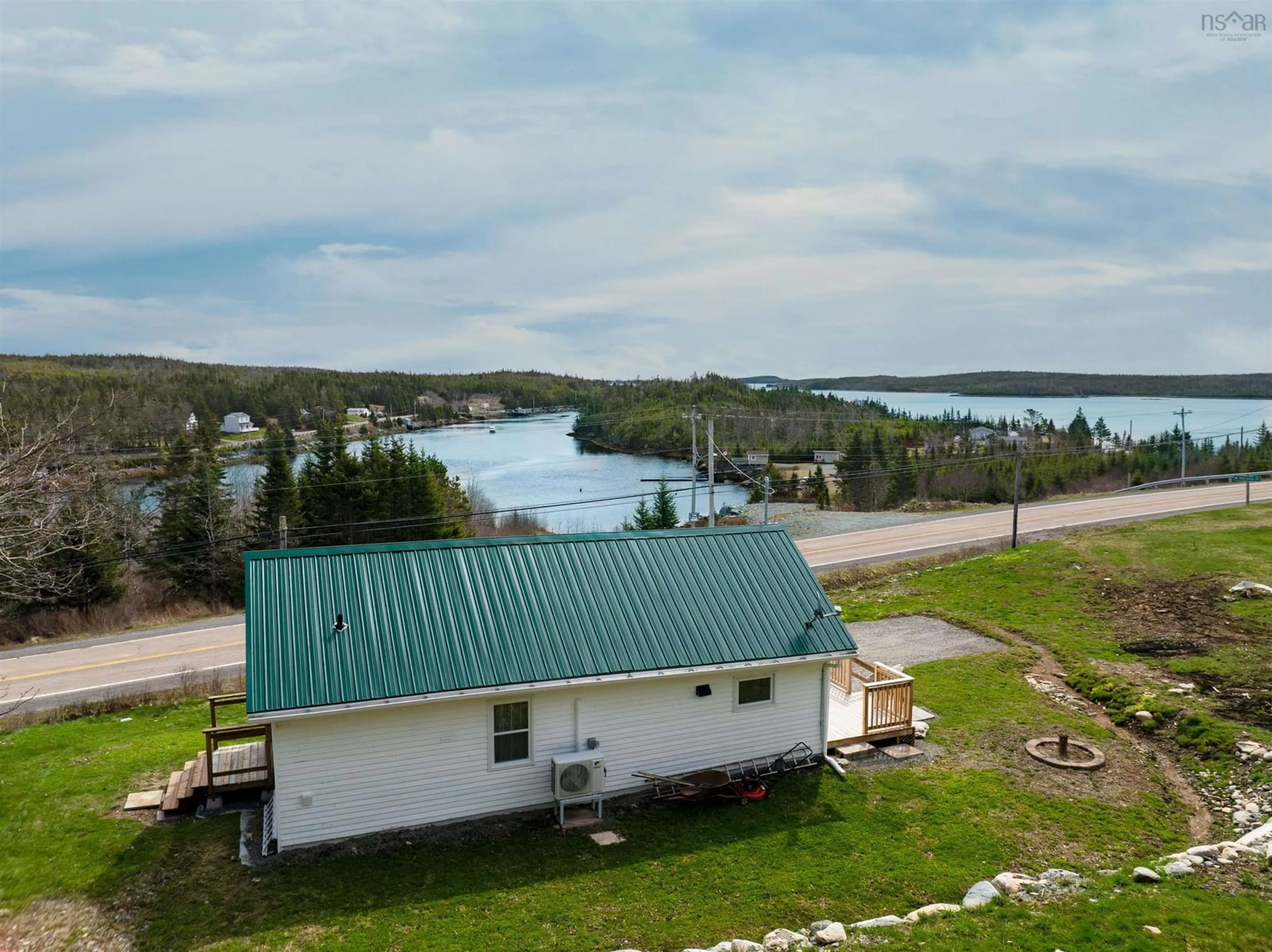 A pic from outside/outdoor area/front of a property/back of a property/a pic from drone, water/lake/river/ocean view for 5067 7 Highway, Liscomb Nova Scotia B0J 2A0