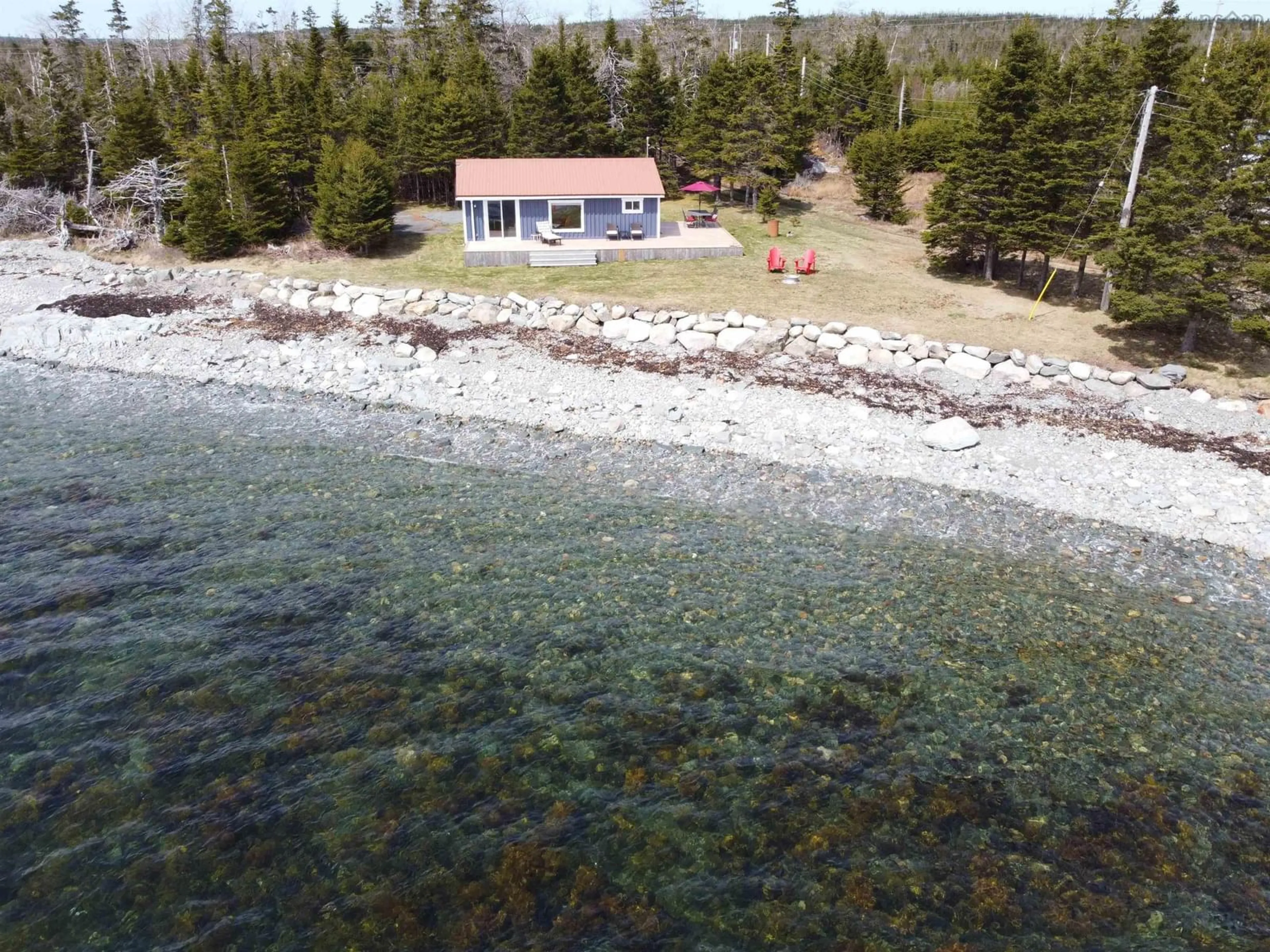 A pic from outside/outdoor area/front of a property/back of a property/a pic from drone, water/lake/river/ocean view for 29608 Highway 7, Necum Teuch Nova Scotia B0J 2K0