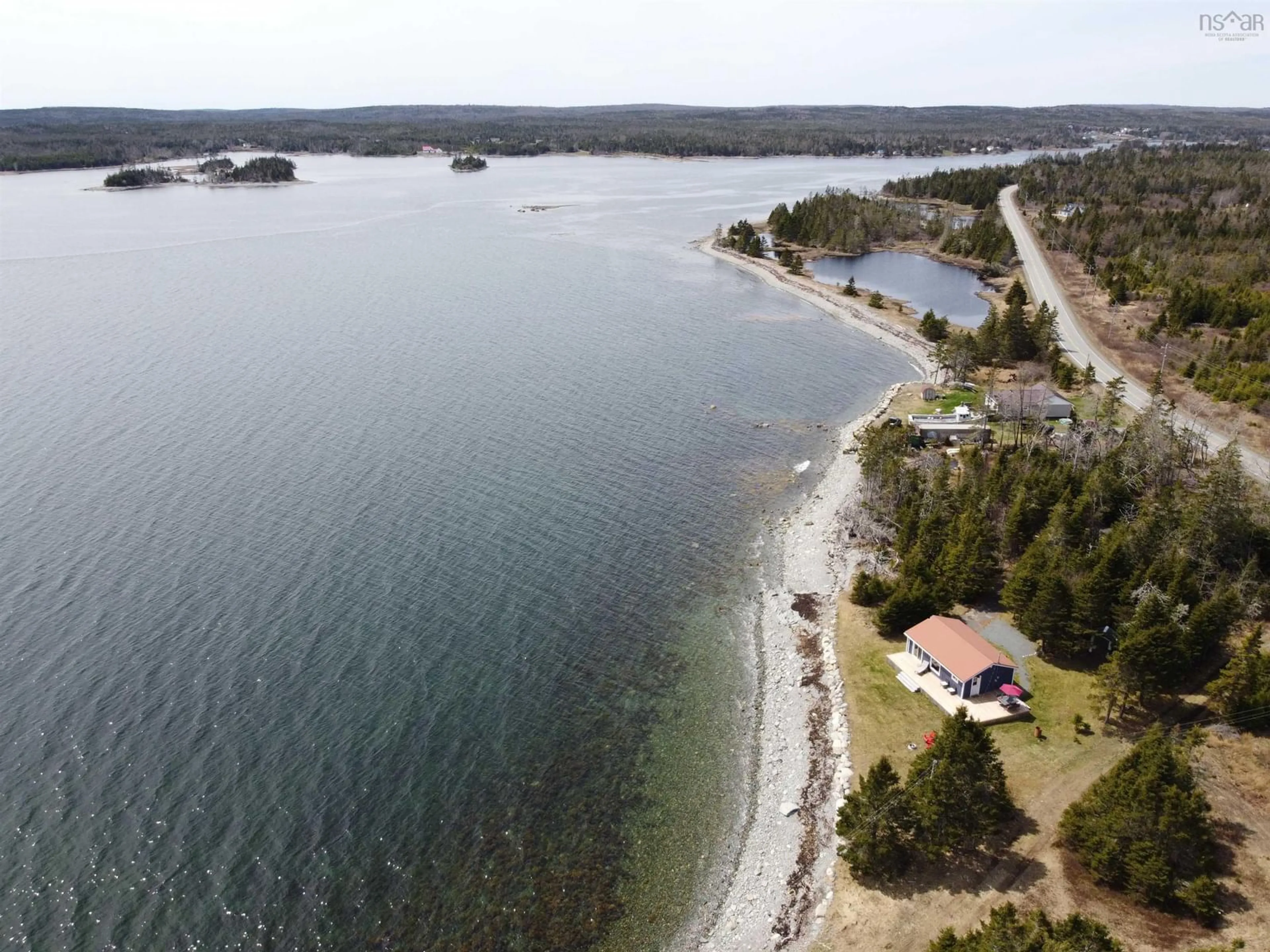 A pic from outside/outdoor area/front of a property/back of a property/a pic from drone, water/lake/river/ocean view for 29608 Highway 7, Necum Teuch Nova Scotia B0J 2K0